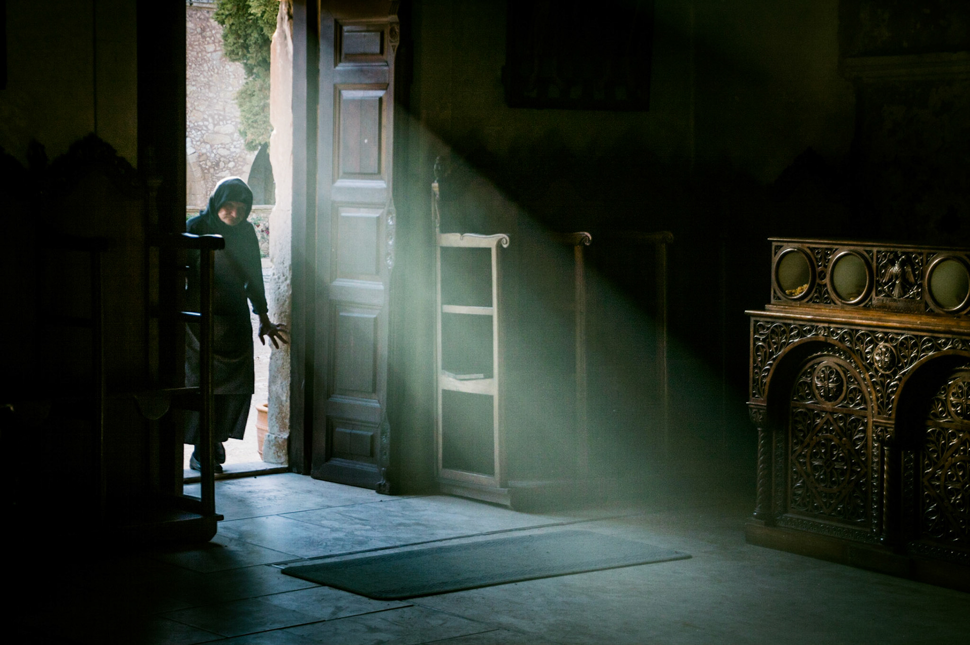 A nun entering the Arkadi Monastery in Chania, Crete