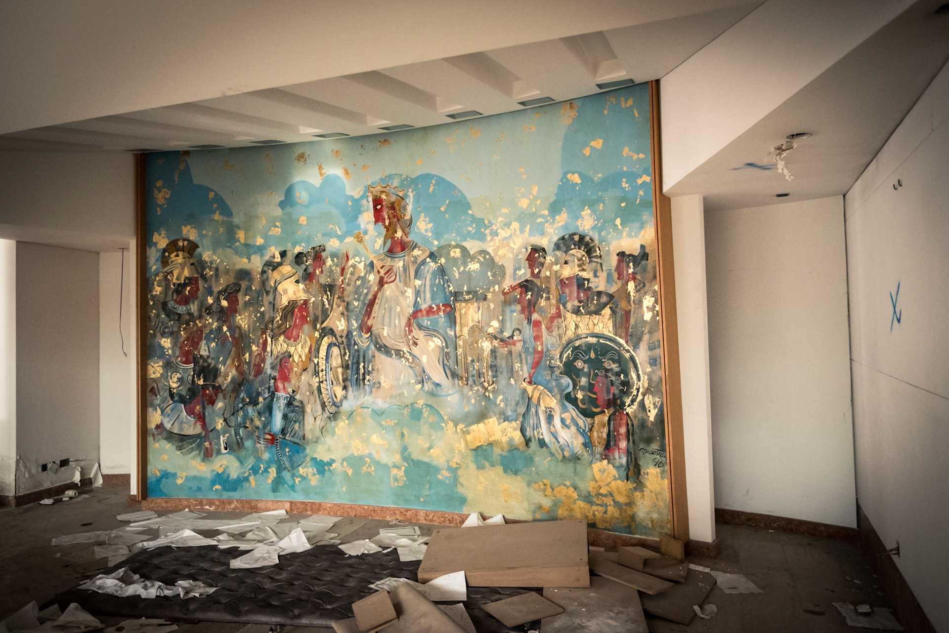 A painting behind the reception in the abandoned hotel
