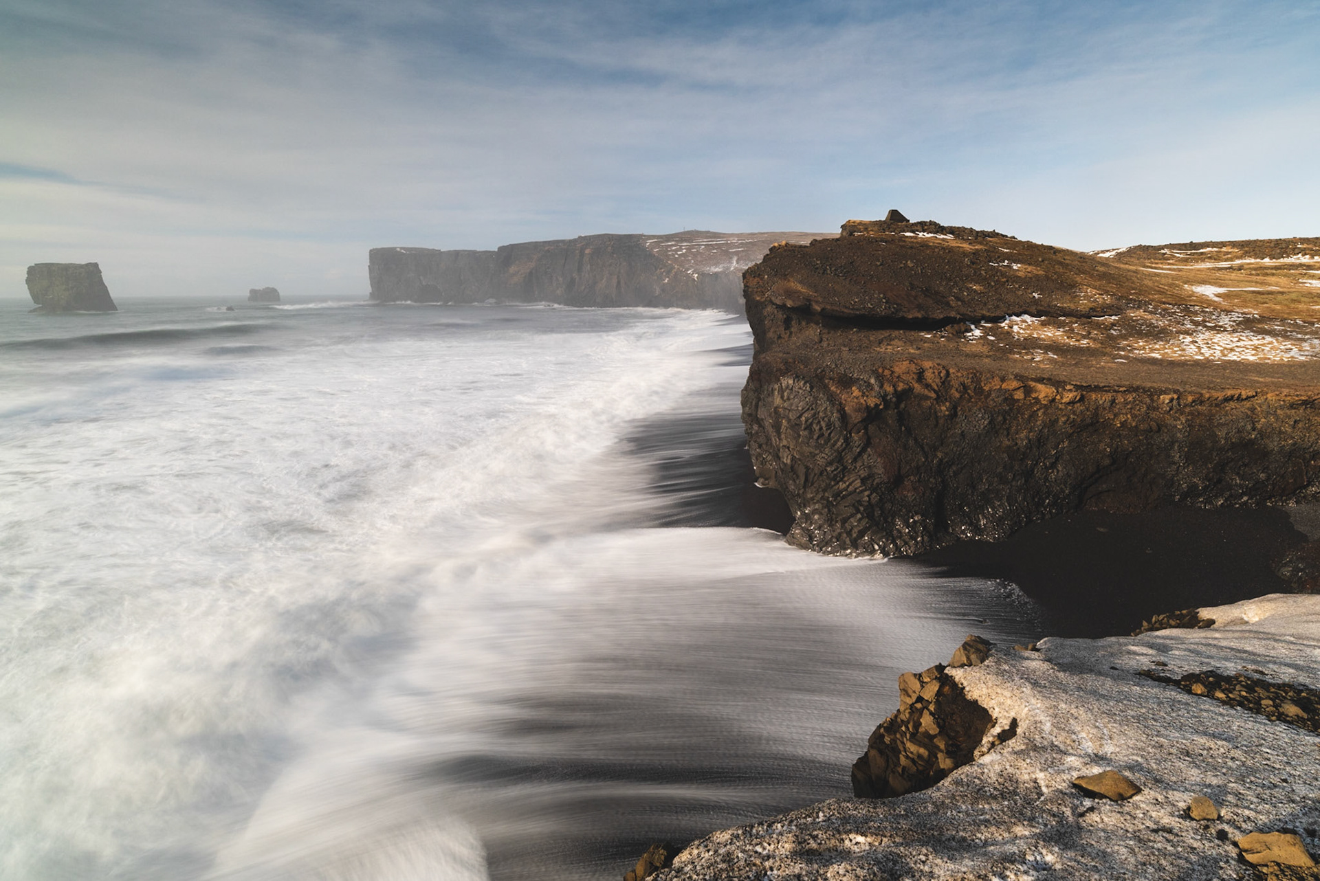 View of Kirkjufjara beach and Dyrholaey from a high viewpoint