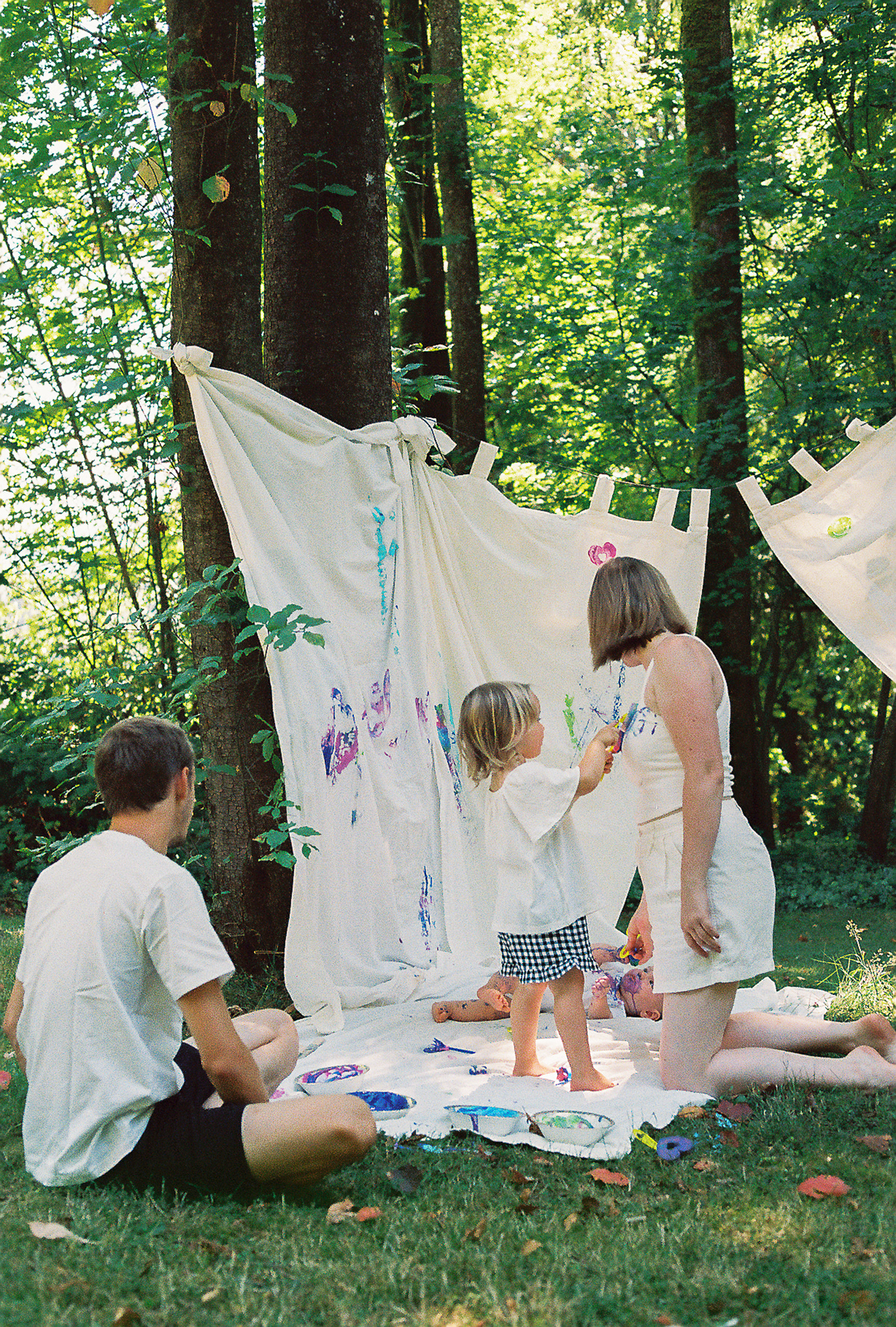 Burnaby family photography on film in a creative backyard session using paint