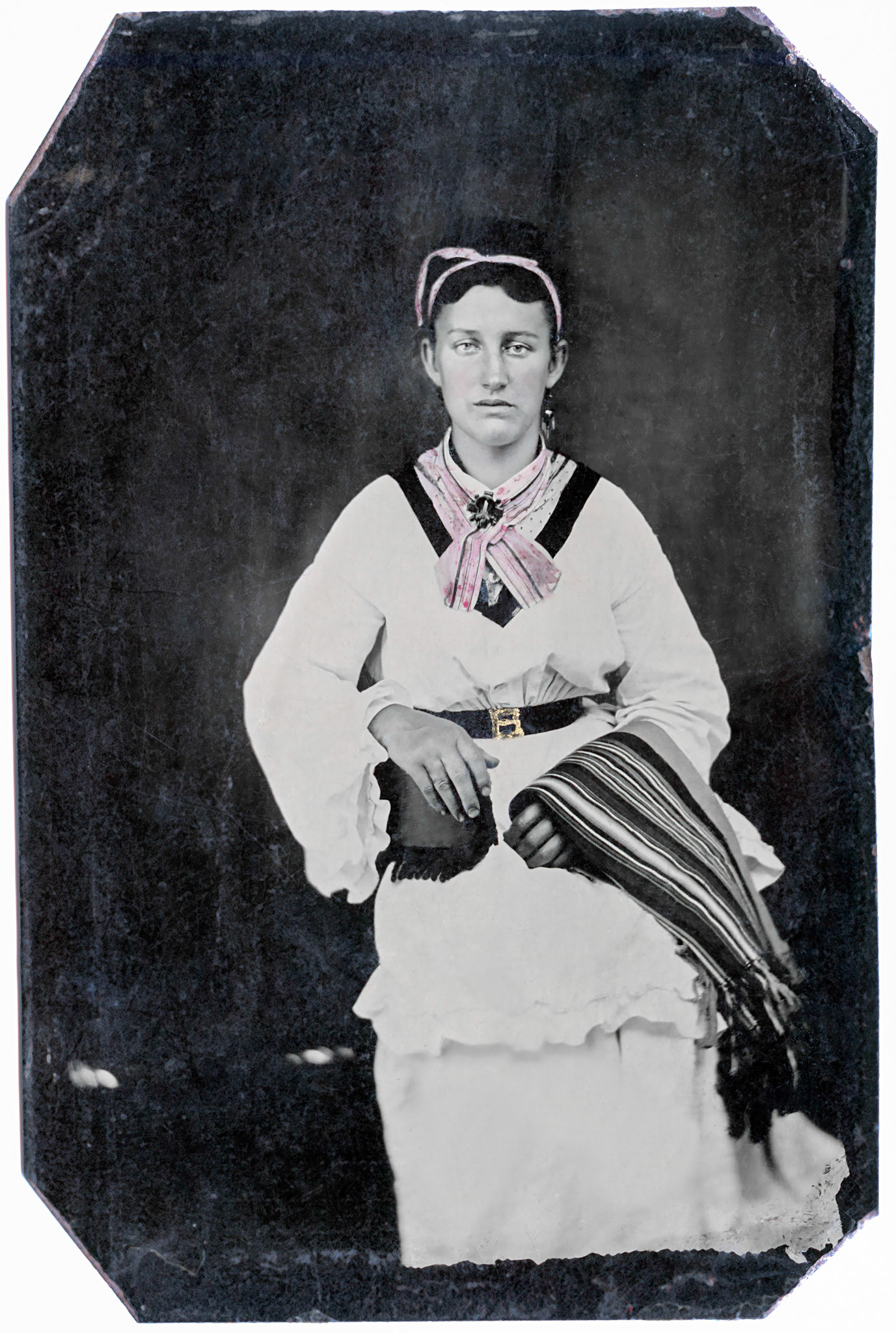No hand coloring was done. The pink and gold were part of the original tintype.