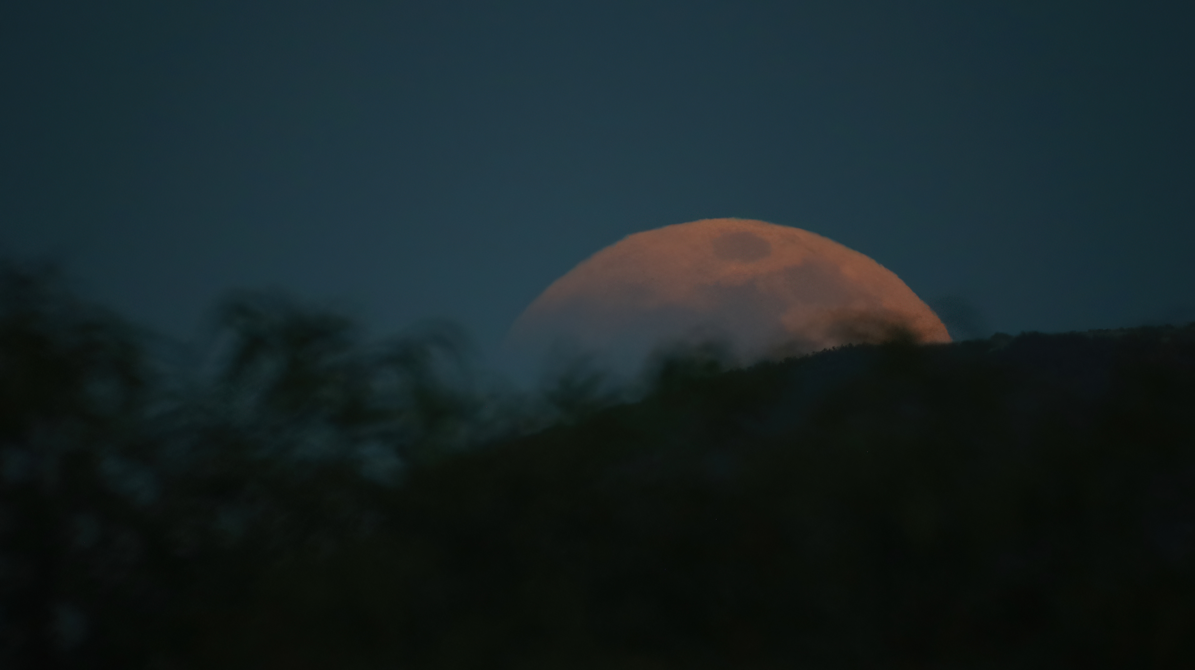 At Moonrise the Super Flower Blood Moon Eclipse