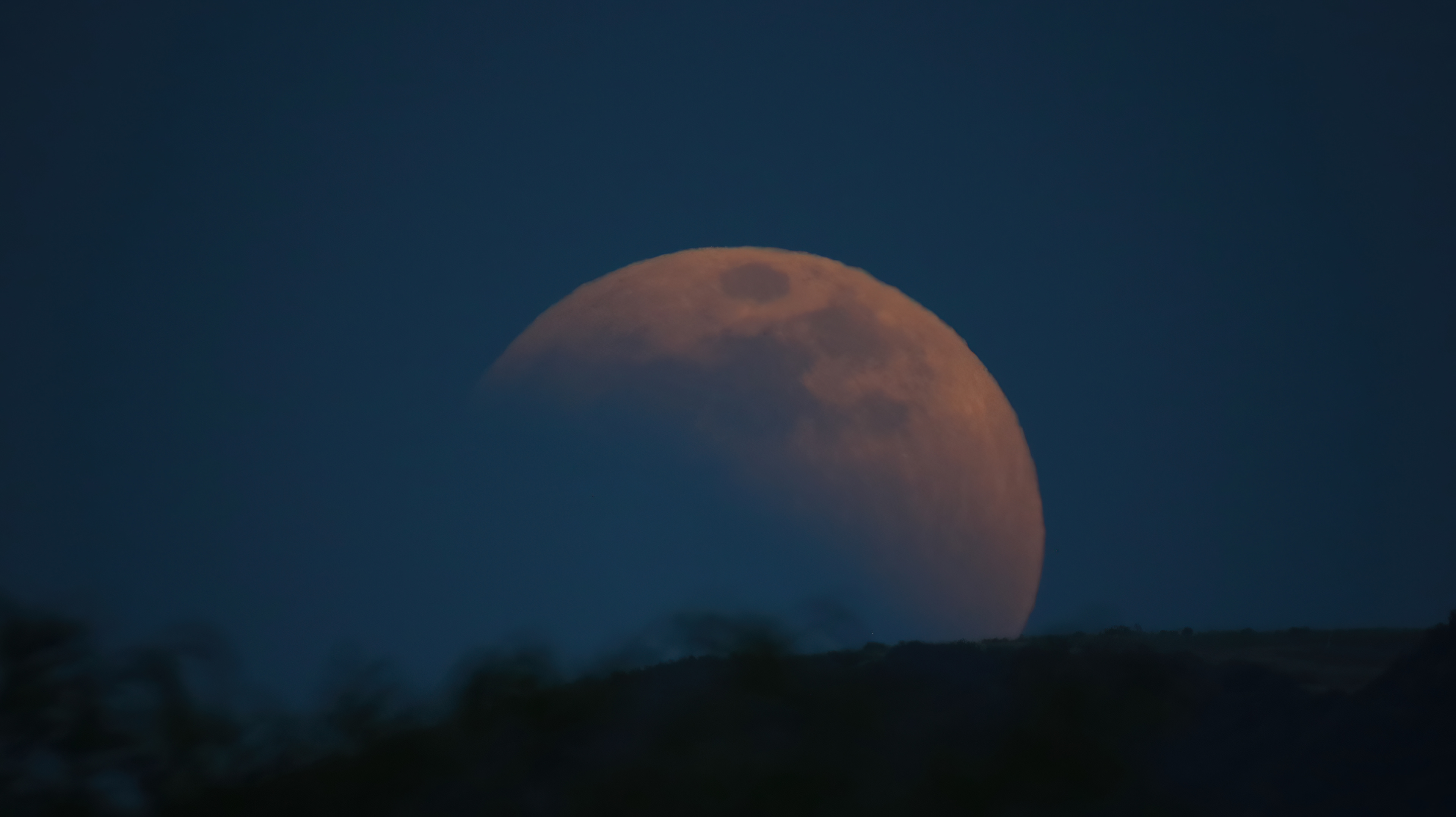 At Moonrise the Super Flower Blood Moon Eclipse