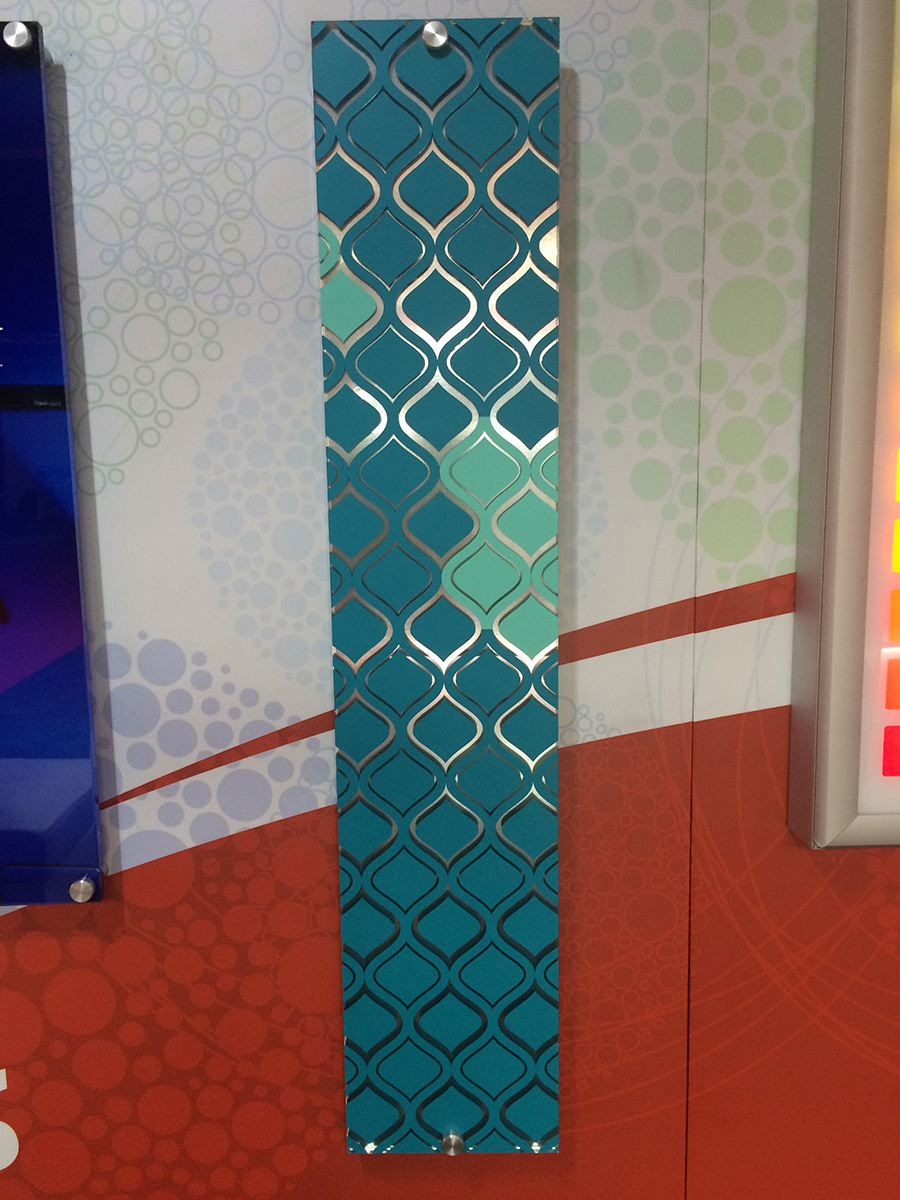 This acrylic panel was created using ORACAL 631 vinyl on the front and ORACAL brushed metal film on the back