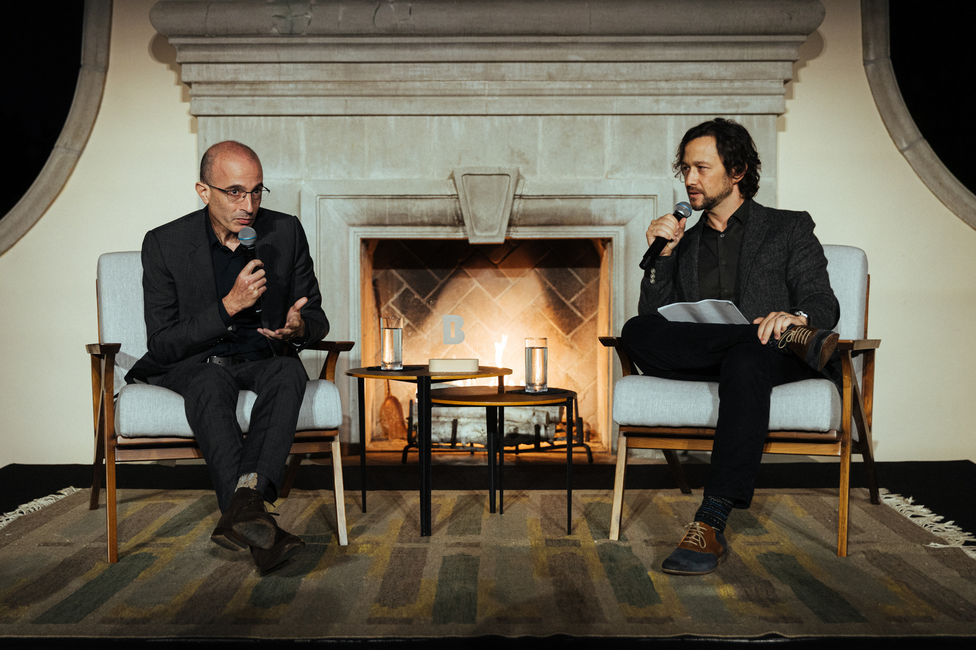 Corporate event photography in Los Angeles: Yuval Noah Harari and Joseph Gordon-Levitt in conversation at a Berggruen institute panel, photographed by Marco Gallico.