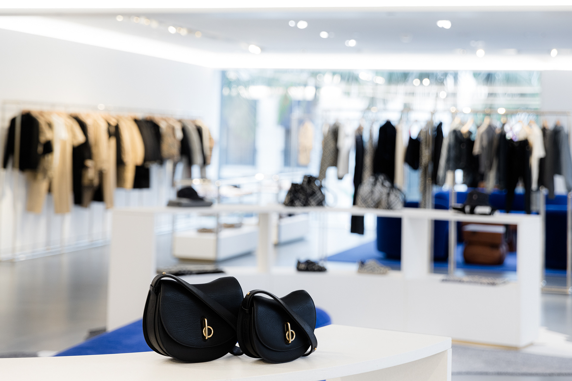Retail store product wall with premium fashion items burberry beverly hills