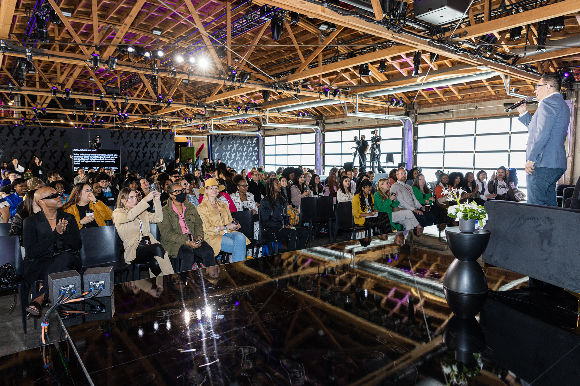 Corporate event photography Los Angeles. Shein CEO on stage photographed by Marco Gallico.