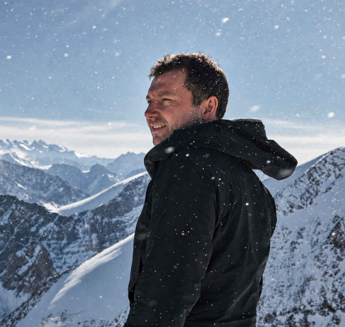 Portrait of Hamish Storey in a snowy alpine landscape, photographed in New Zealand