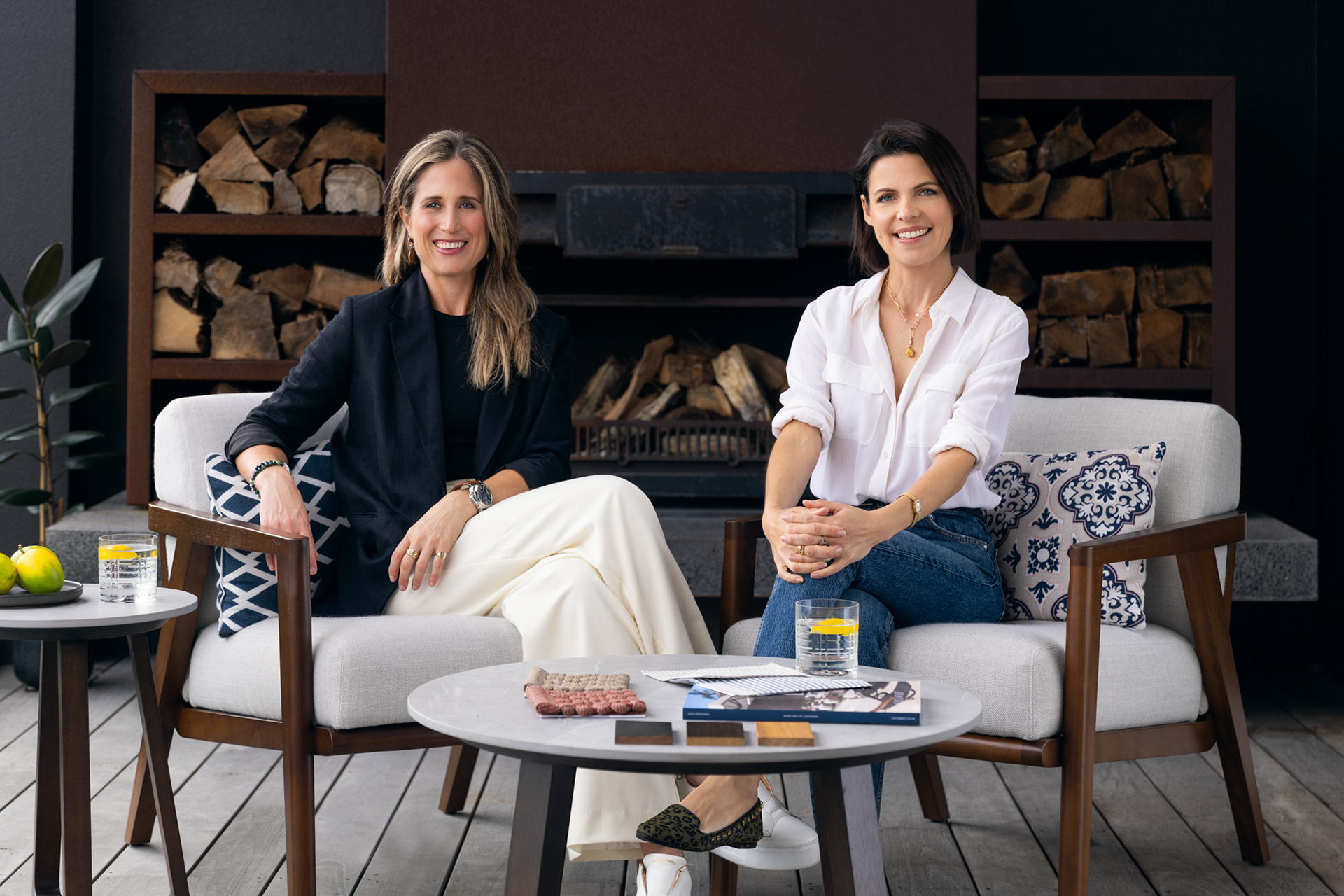 Kristina and Nicky from Coco Wolf seated together for a professional team portrait