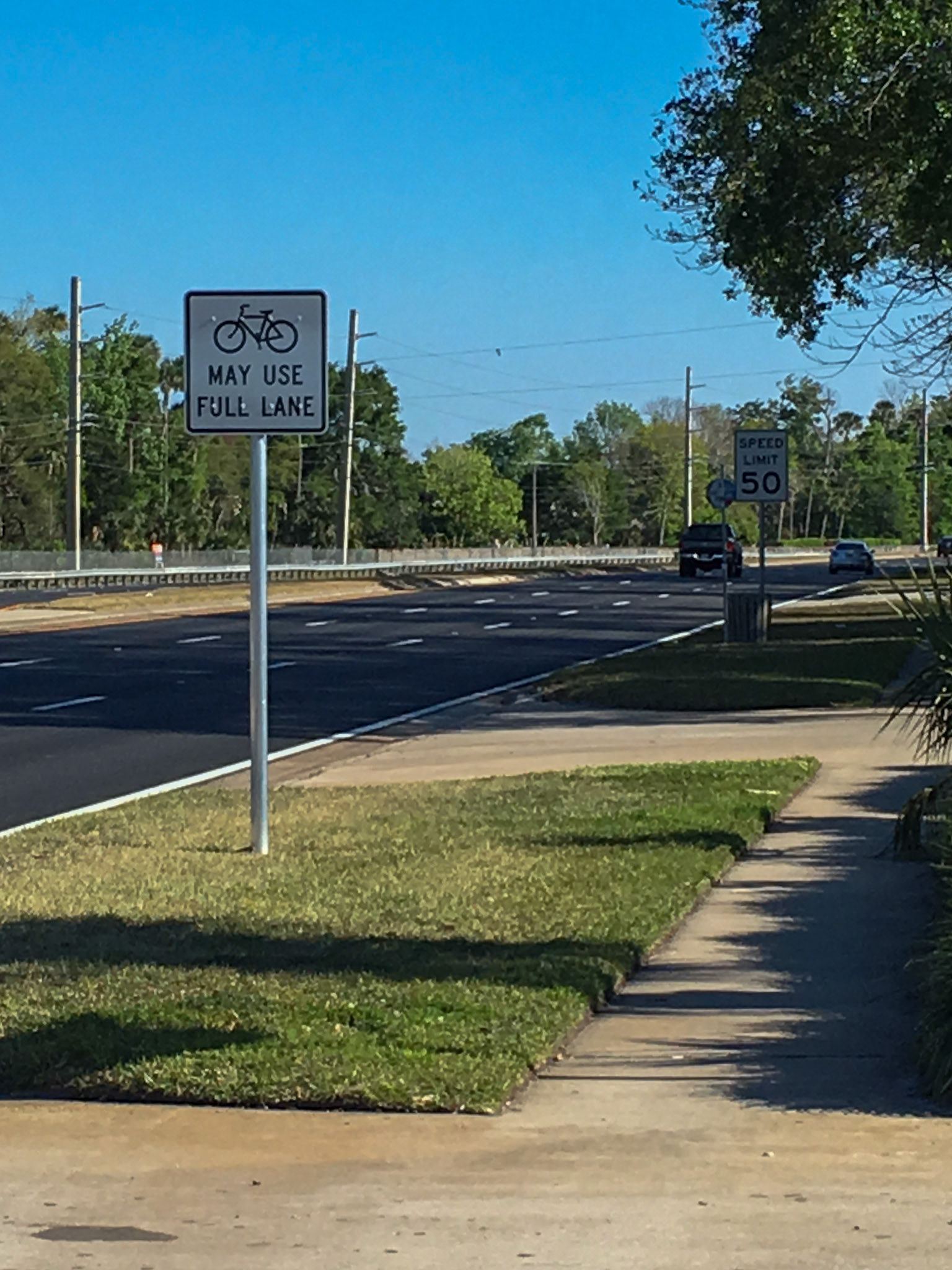 Problem: Resurfaced south-bound Nova Rd, near Bellevue Ave in Daytona Beach.  There is no shoulder or bike lane, but you can share the lane with 50 mph car traffic or use the narrow sidewalk.