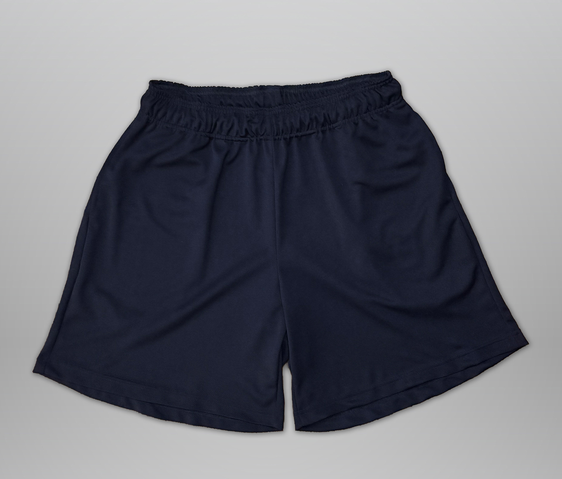 Sewn from navy mesh. Features elastic waistband, drawstring, and 2 deep side hem pockets. Slightly cropped fit (above the knee).