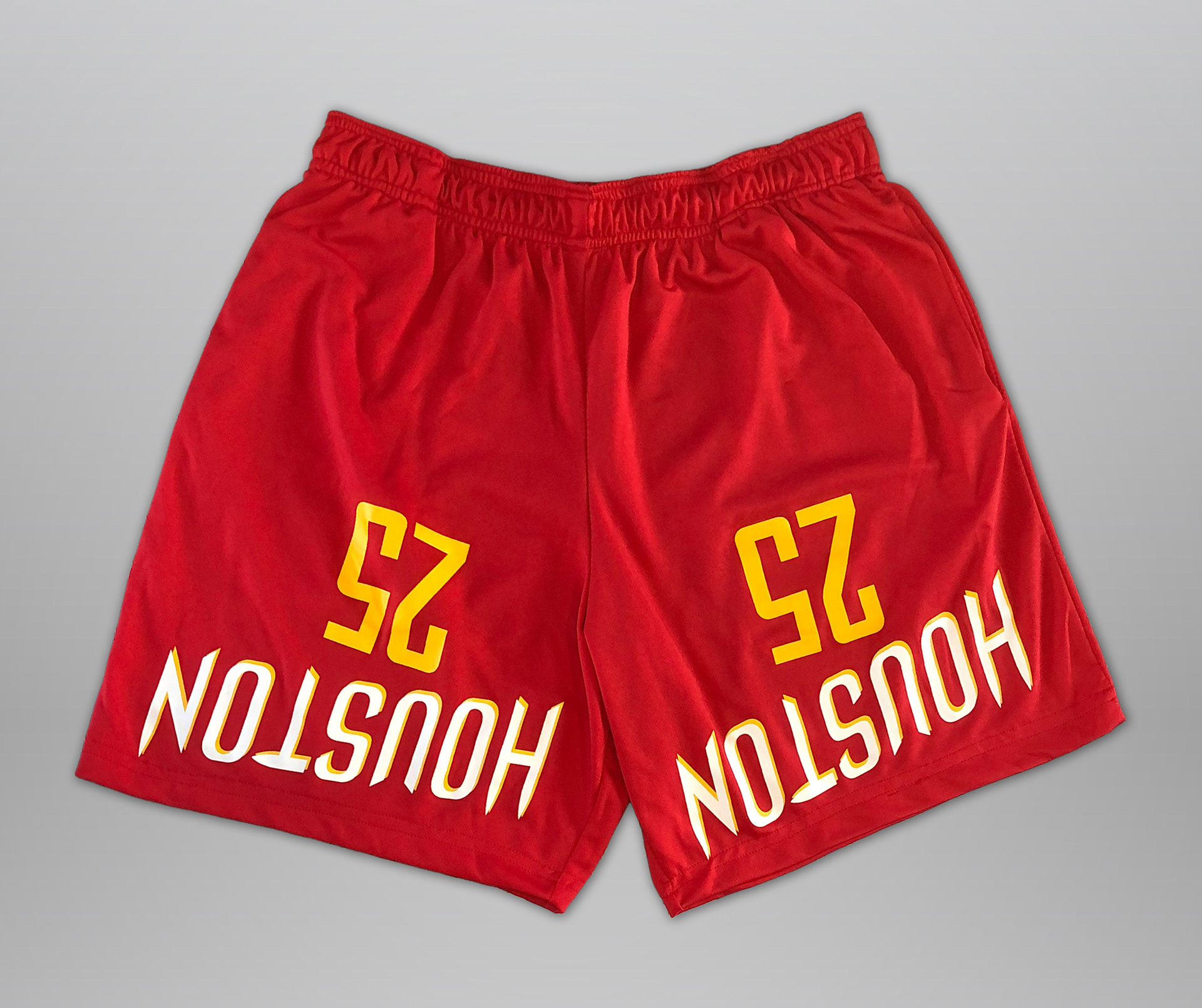 Sewn from Houston Rockets jersey. Features elastic waistband, drawstring, and 2 deep side hem pockets. Slightly cropped fit (above the knee).