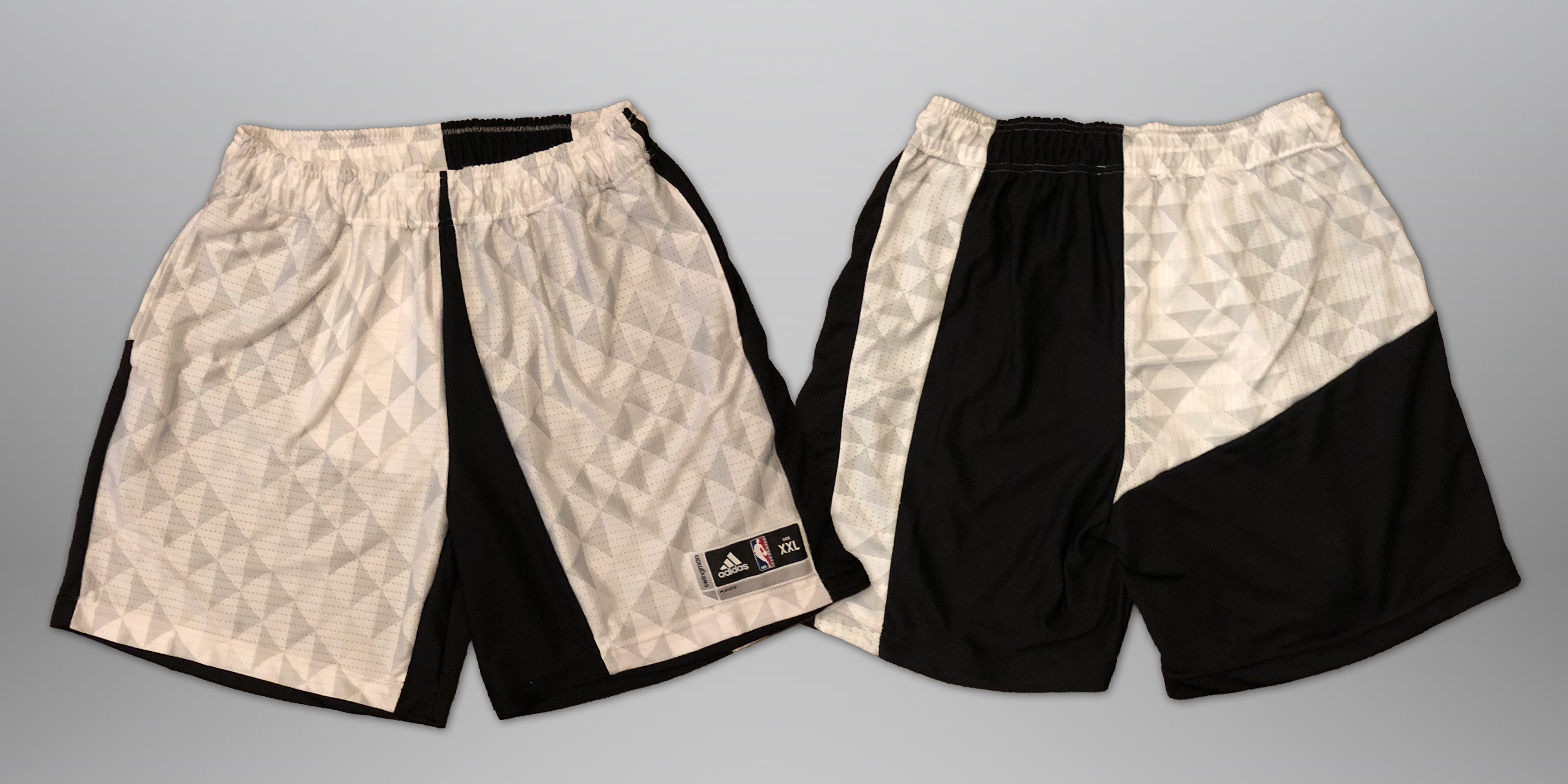 Sewn from jersey scraps. Features elastic waistband, drawstring, and 2 deep side hem pockets. Slightly cropped fit (above the knee).