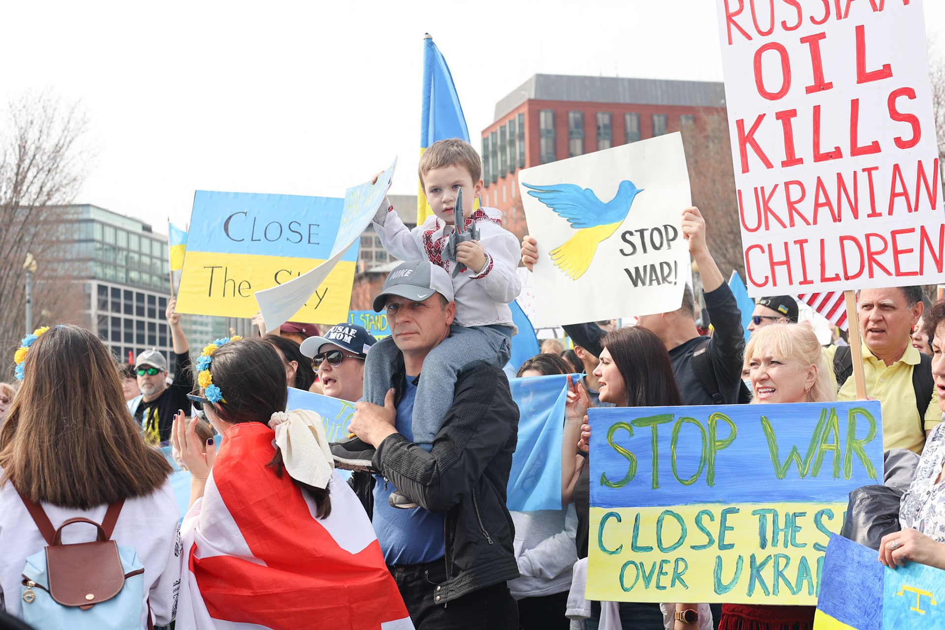 February 12, 2023 - The White House, Washington, DC. Ukrainian allies rally demanding that President Biden "close the sky'.  A little boy brought his fighter jet toy.