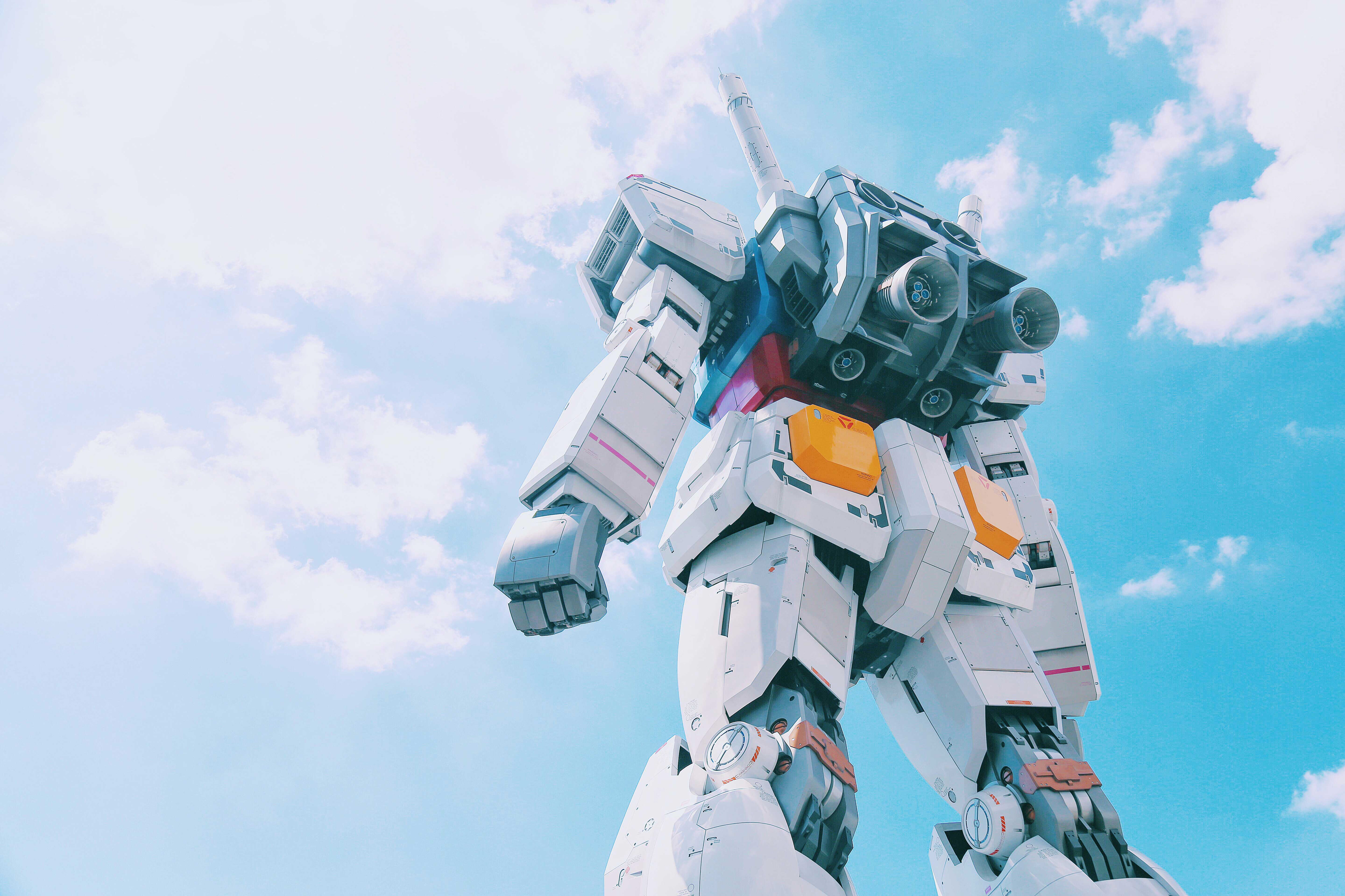 Gundam towering under blue sky