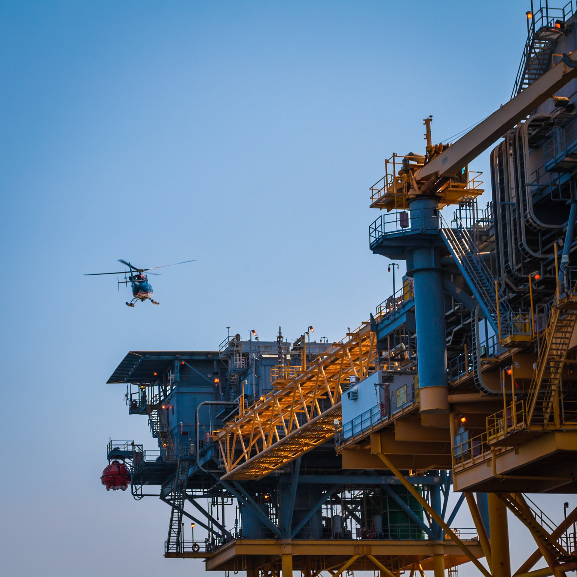 Helicopter taking off from an oil rig platform in the Gulf of Mexico.