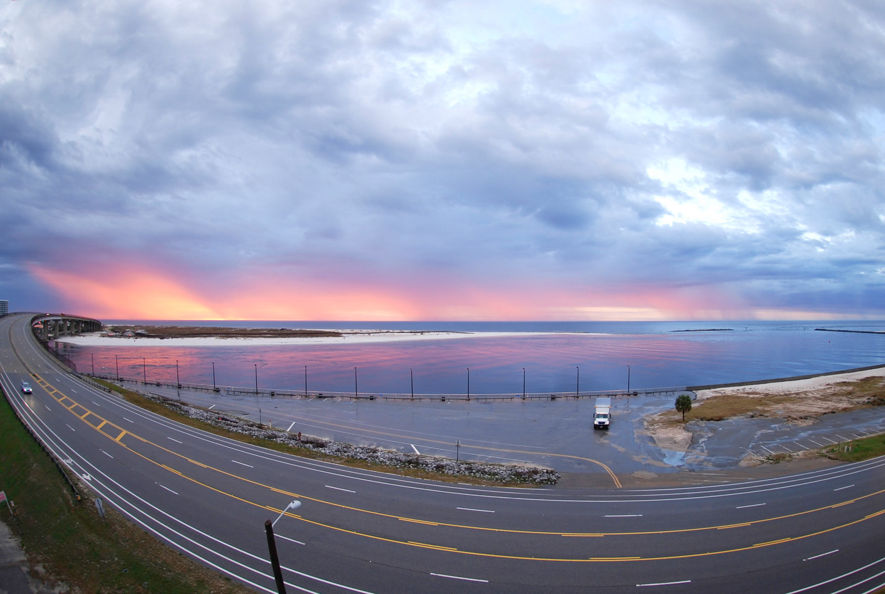 Fisheye lens shot of sunrise over Perdido Pass, Orange Beach, Alabama.