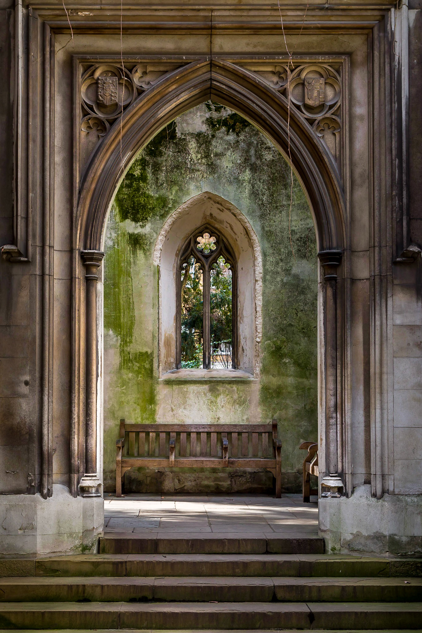 Belated image due to having last week off, so I wasn't in London.  Took this as soon as possible on Monday so worst case scenario I was 12 hours late.  Sorry.

Been to this location many times over the past 11 weeks but haven't found the shot I wanted, I almost missed this one too.

St Dunstan-in-the-East is a fascinating place, its an old church that was damaged in the great fire of London, repaired, blew up in the second world war at which point they gave up repairing it and turned it into a garden instead.