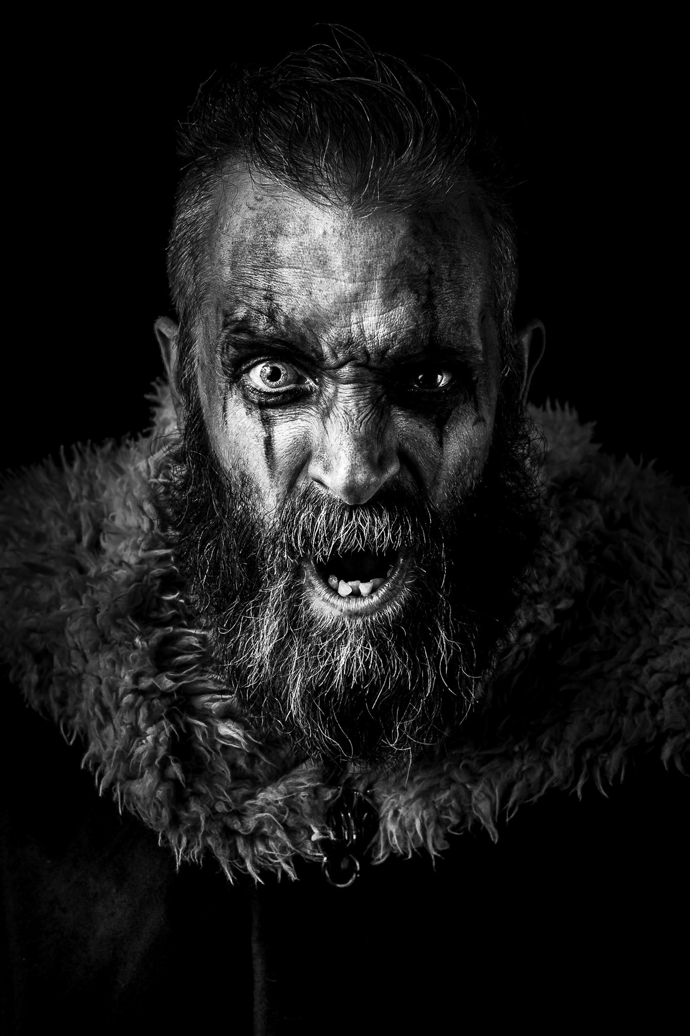 I have been growing my beard for some time, and after looking in the mirror one morning, I thought that my beard had become rather Vikingesque. Using this as an inspiration for a shoot, I knew I wanted to create an image that was low key and gritty. My wife assisted me with the hair, makeup and costume.