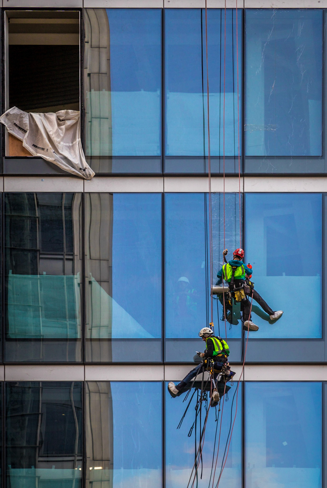 An example of why I always try to carry my camera everywhere.  I was rushing back to the office and saw these chaps hanging around.  Only took one frame and only noticed the chap checking his phone when I got it uploaded to the computer.