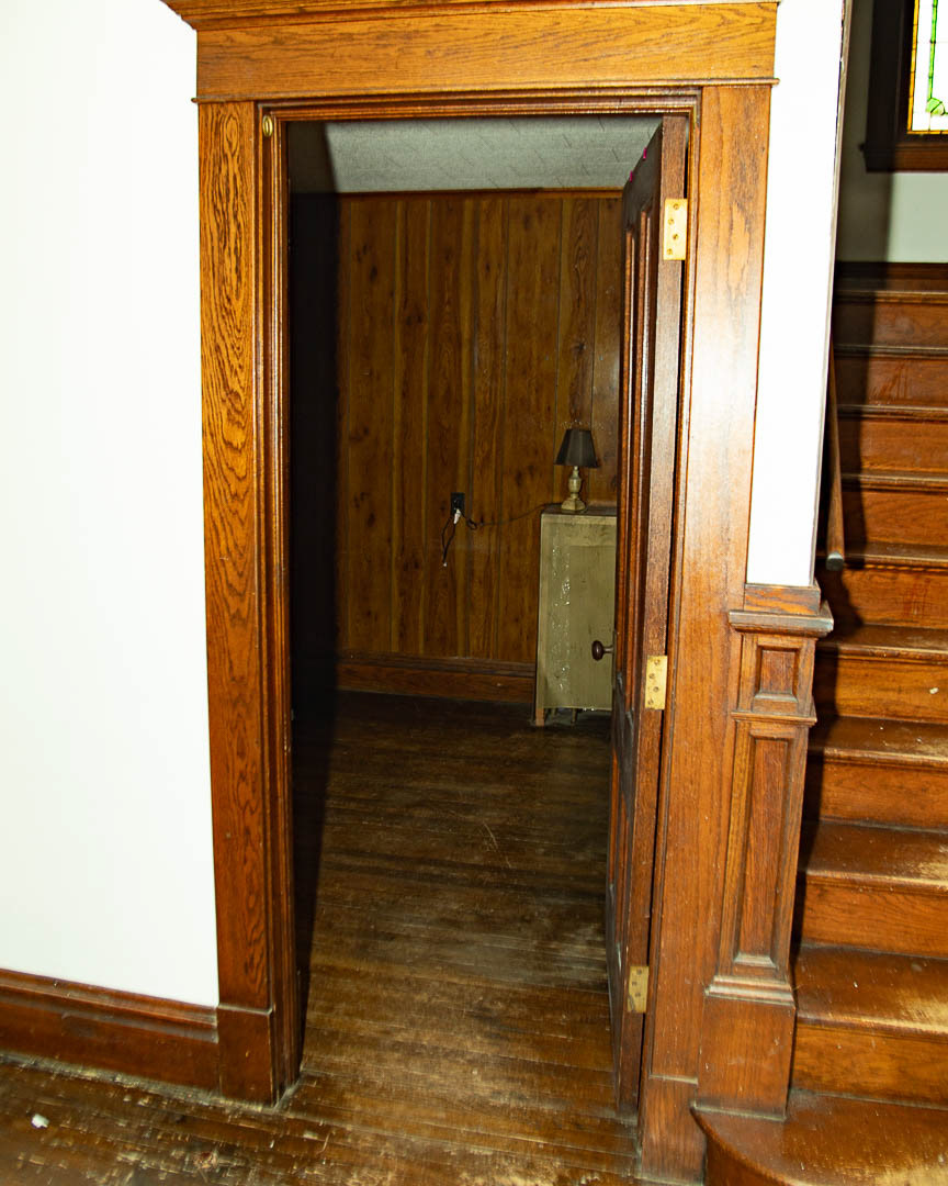 Main Hallway looking into Den and Main Stairs
