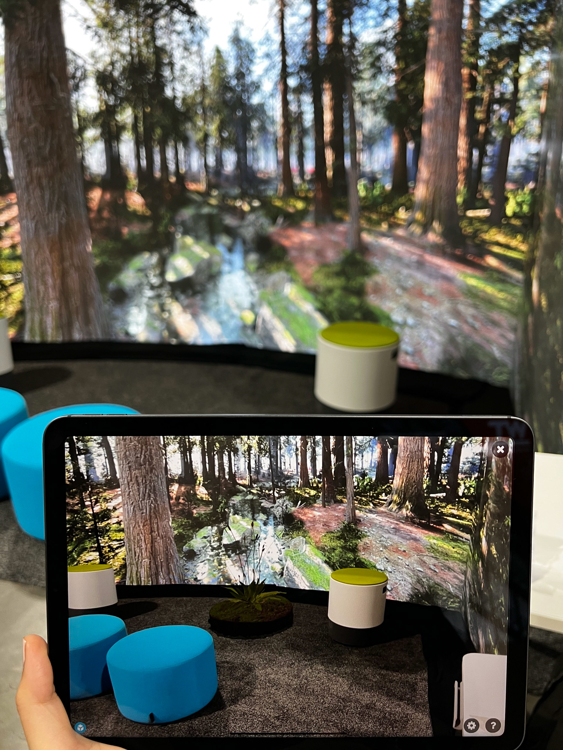 Bridging the digital and physical worlds. AR + immersive interactive background experience.