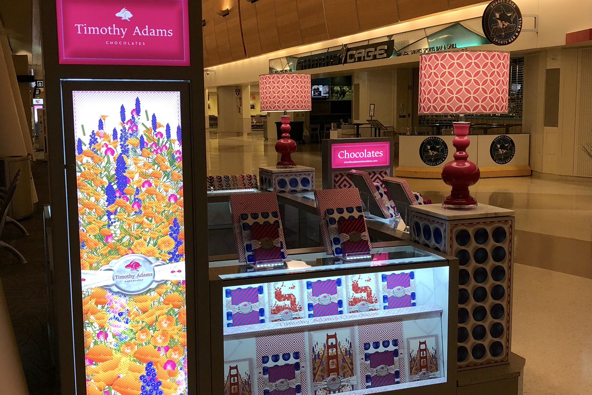 Timothy Adams Chocolates airport retail kiosk with custom merchandising, signage, packaging displays, and branded environmental graphics.