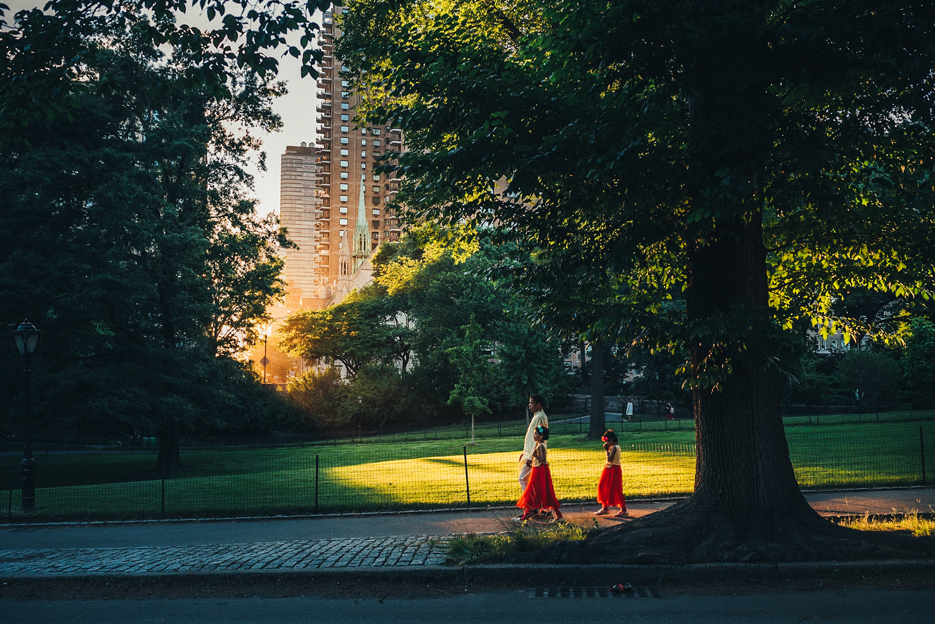 Family walking through Central Park in New York City. Photo taken by Dean Shu.