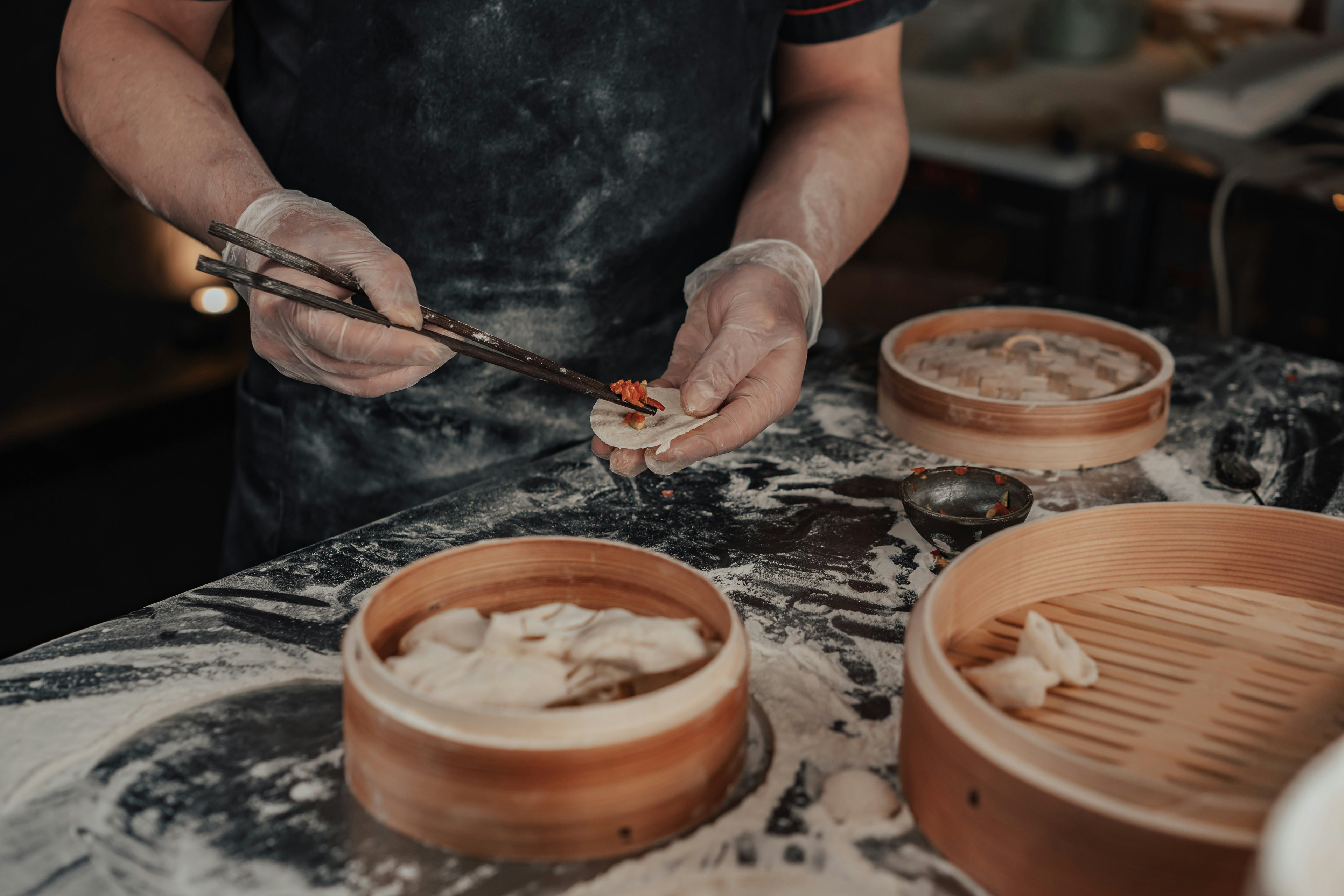 hands making dumpling for dimsum
