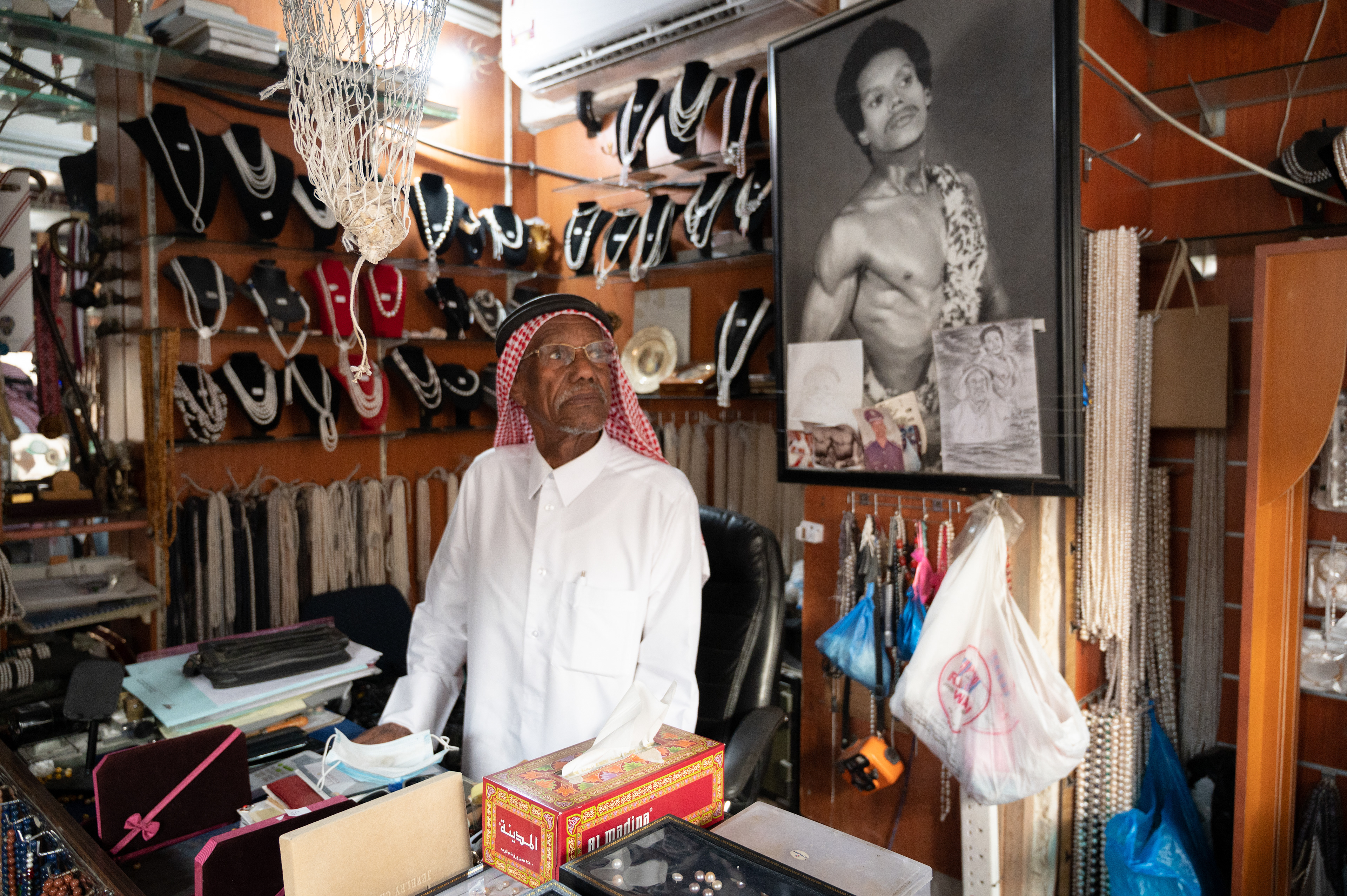 He greets visitors to his shop with tales of the trade, and demonstrations of his physical strength.