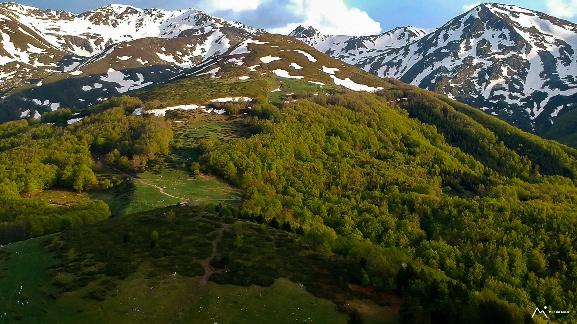 Drone-Captured Photo of Prevalac, Kosovo: A Green Mountain with a Touch of Snow