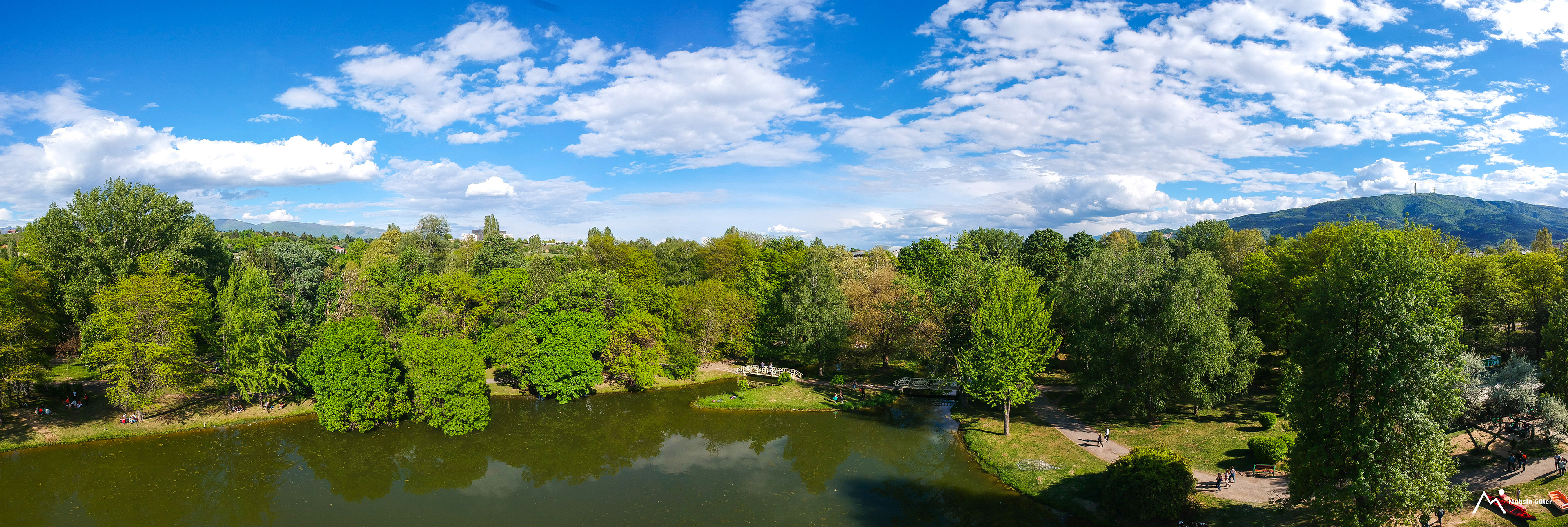 Panoramic City Park in Skopje, North Macedonia - A Stunning Drone-Captured Photo of Green Trees and Blue Sky