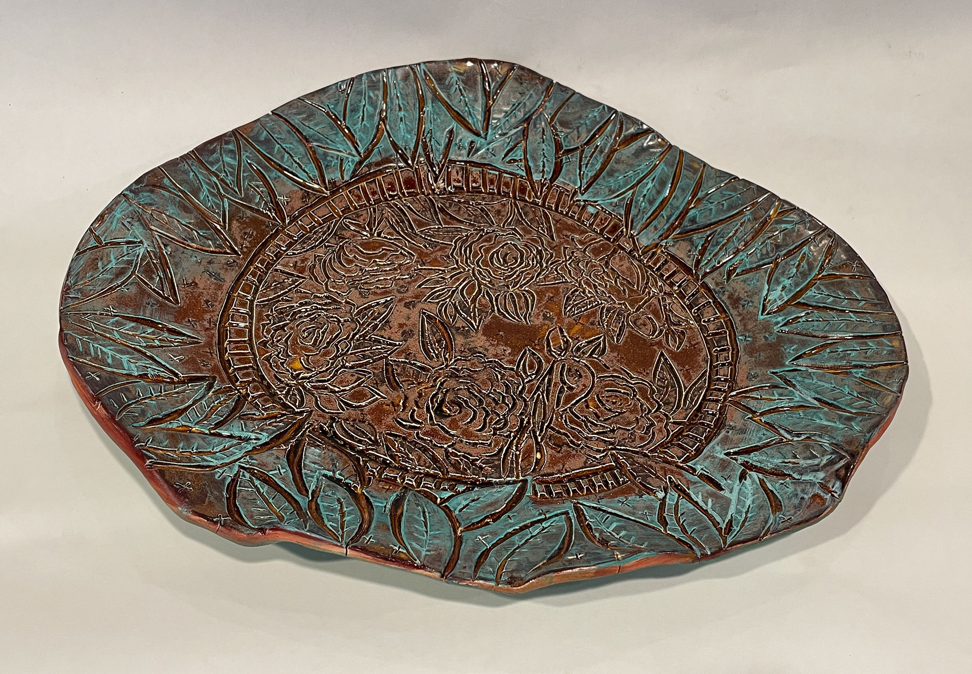 C6 / Floral Charger with Verdigris Border, 14" wide, sale price, $295 