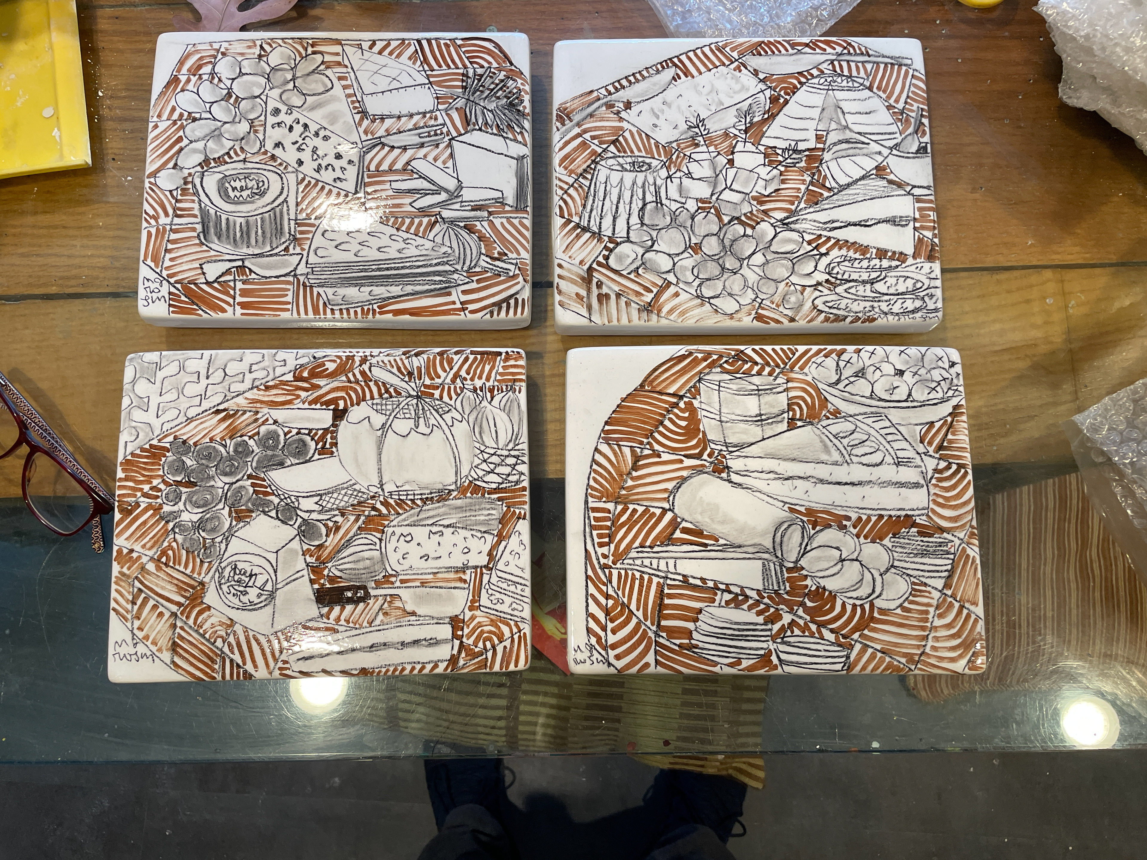 A variety of cheeseboards created on 8" x 10"bisqueware 