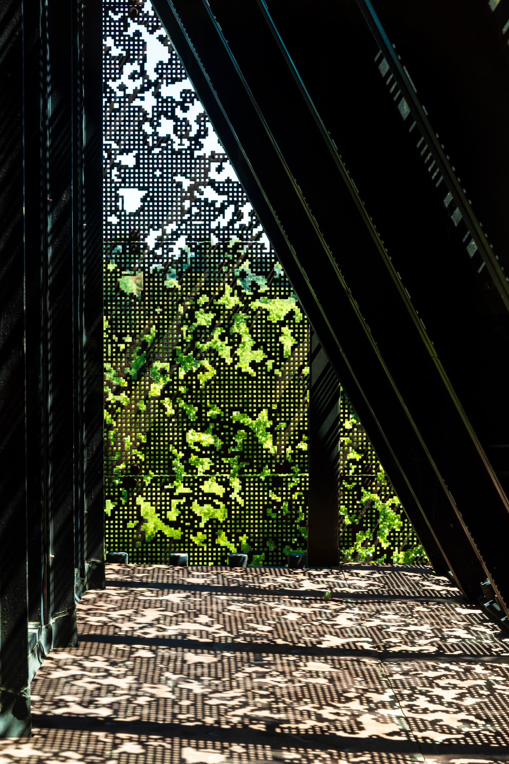 Light filtering through the perforated cast-iron crown onto the top-floor café.