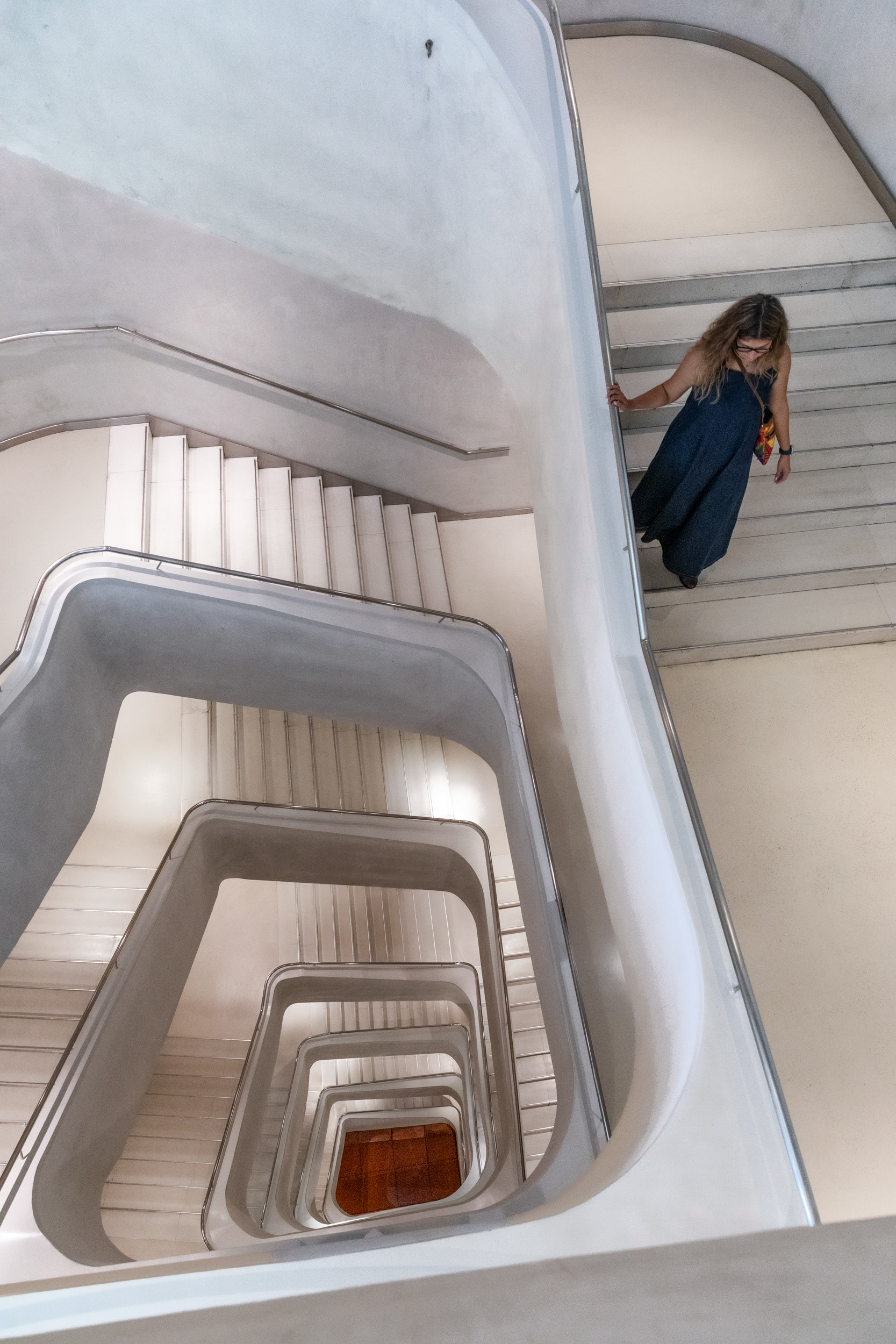 The plaster-clad spiral staircase linking the upper gallery floors.