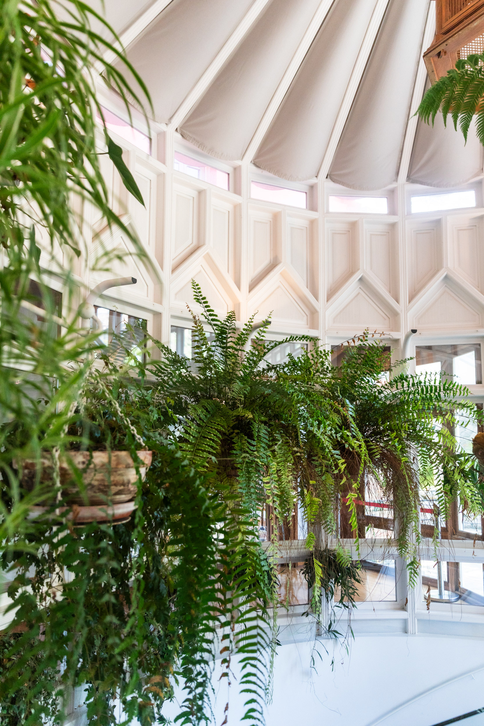 What stands today is a 1988 reconstruction; the timber-and-glass original was dismantled in a remodelling of 1914.
