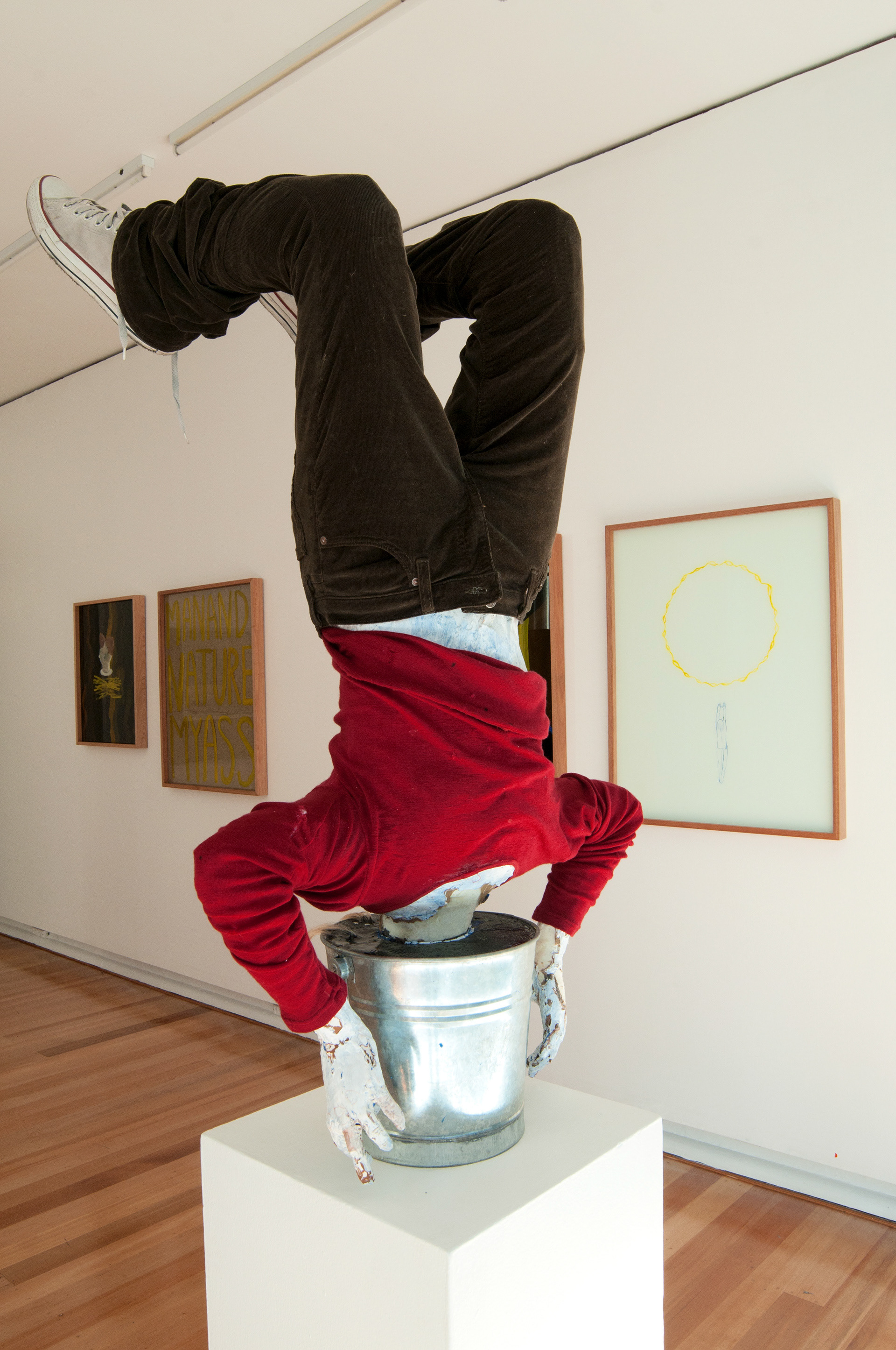 Hope for Humanity, cement, metal bucket, fabric, expanding foam, various tapes, acrylic, enamel, resin, oil, synthetic hair, old wool jumper, shoes, corduroy pants, 110 x 60 x 70 cm
