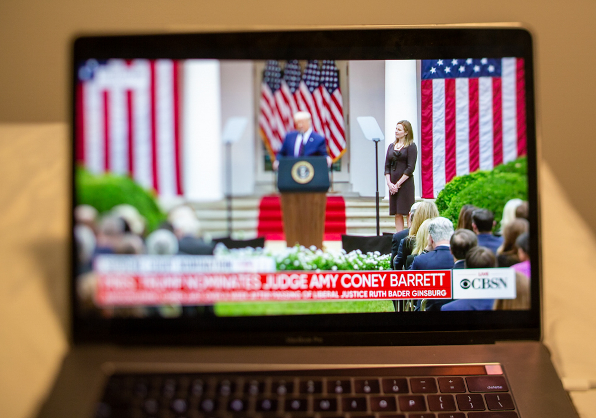 Judge Amy Coney Barrett stands with President Trump at a White House ceremony to announce her as the next nominee for the Supreme Court on September 26, 2020, televised in Rochester N.Y.