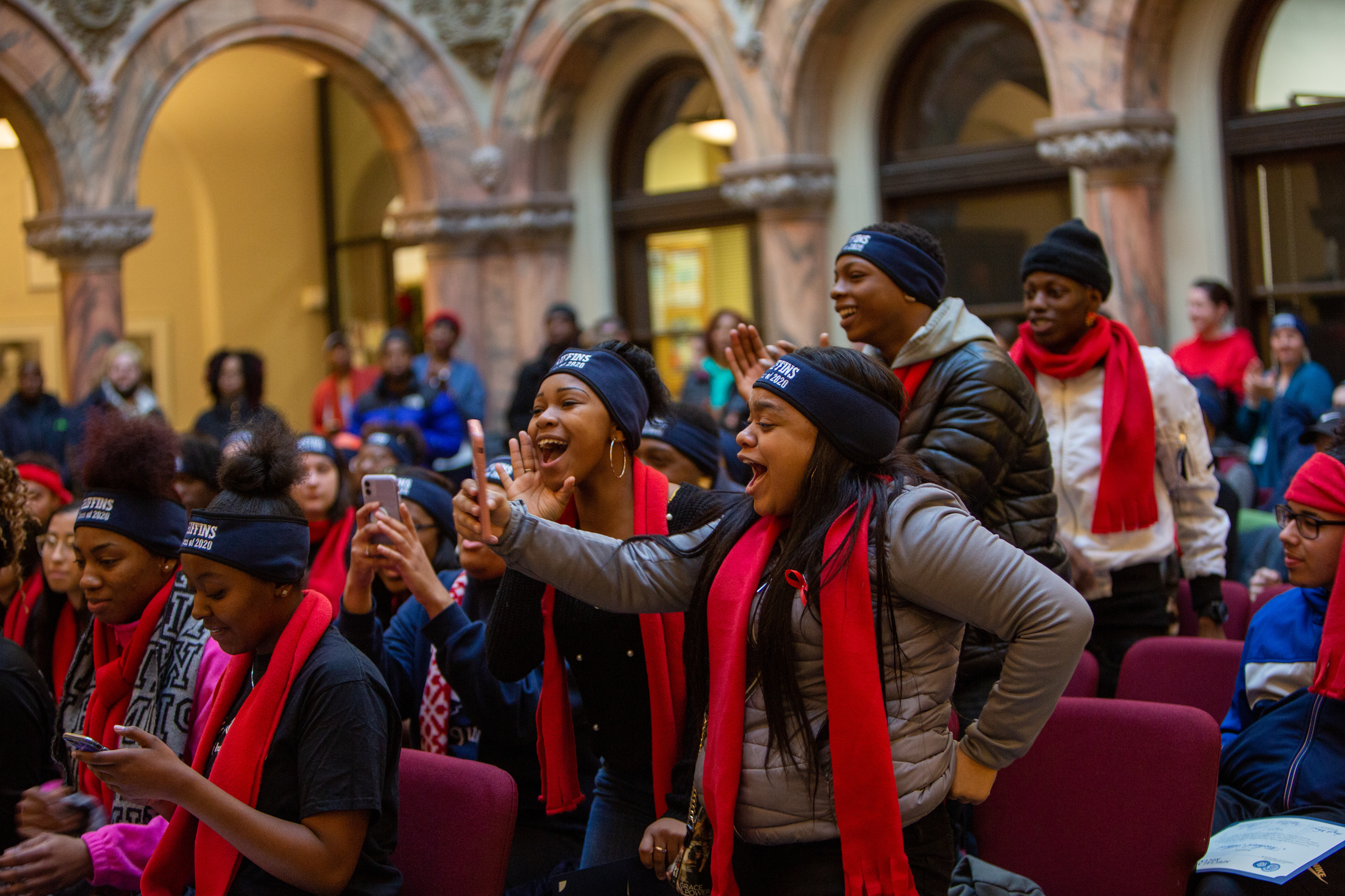 Class seniors cheer at the College March, as each of their fellow classmates are called to drop his or her letter of intention in the mailbox in Rochester, N.Y. on December 13, 2019.