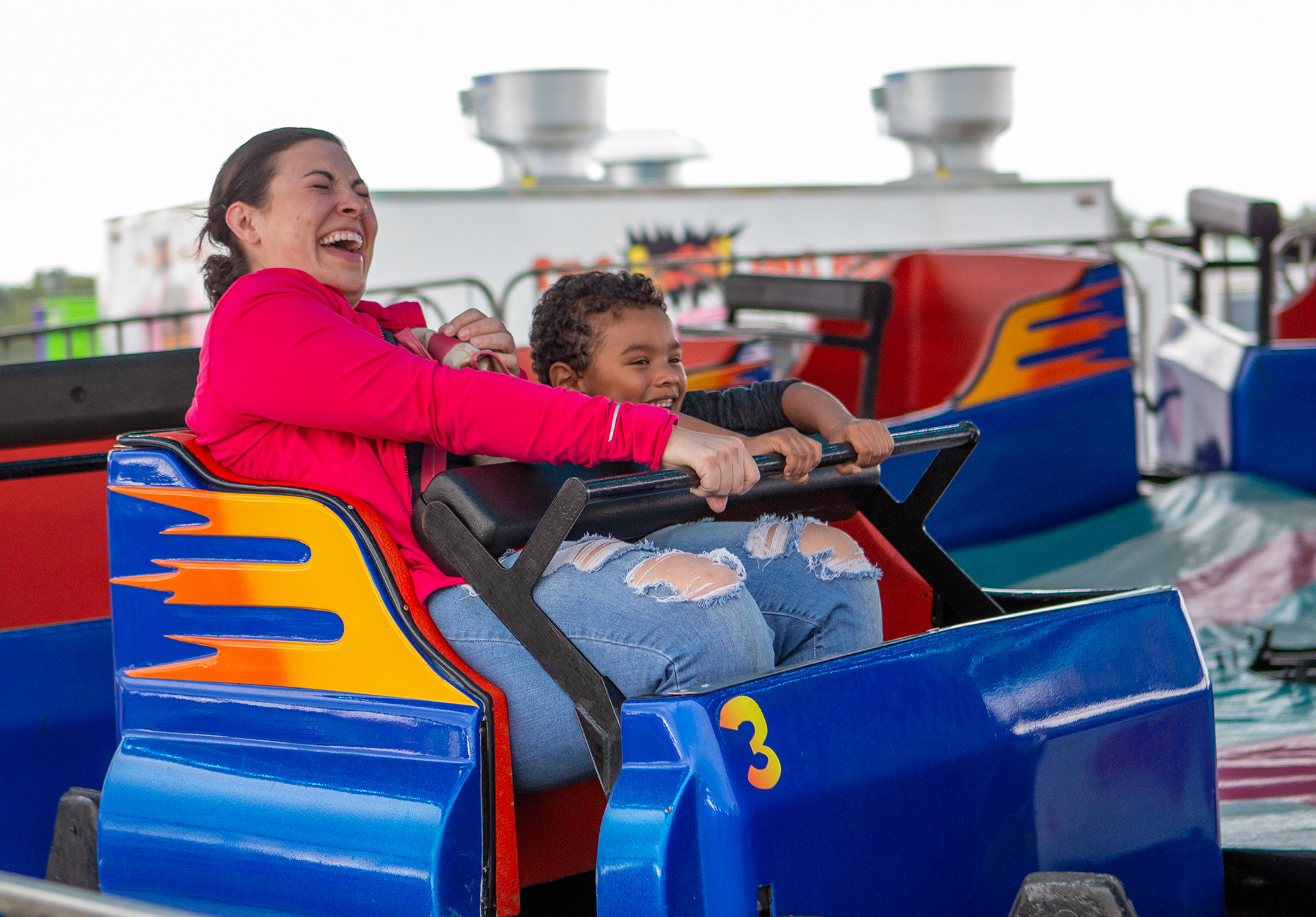 Michelle Walters and Drew Branch enjoy a ride together on the Midway at the New York State Fair, while Drew yelled to his grandmother “help, grandma, help!” on September 2, 2019 in Syracuse, N.Y.