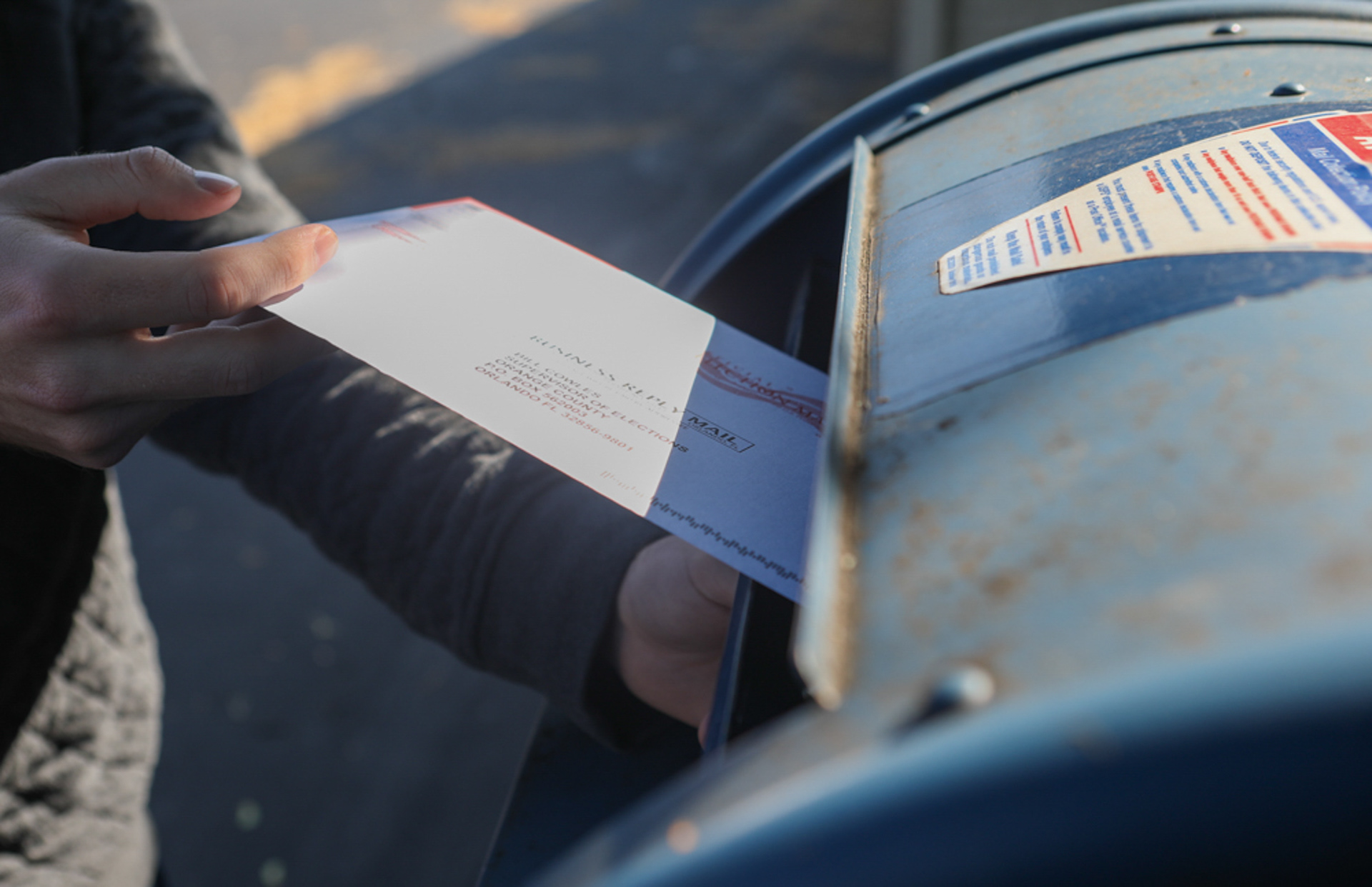 Dylan Baker walks to a mailbox down the street from his apartment to drop his absentee ballot into the mail on October 9, 2020, Rochester N.Y. Baker is from Florida, and so he requested an absentee ballot and had his father send it to him. This was Baker’s first time voting in a presidential election.