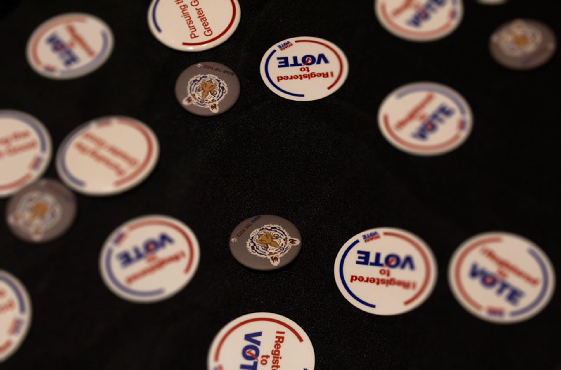 A 2020 Trump v. Biden debate viewing party at R.I.T.’s Ingle Auditorium takes place on September 29, 2020 in Rochester N.Y. A table outside of the event offers stickers and pins for those who register to vote.