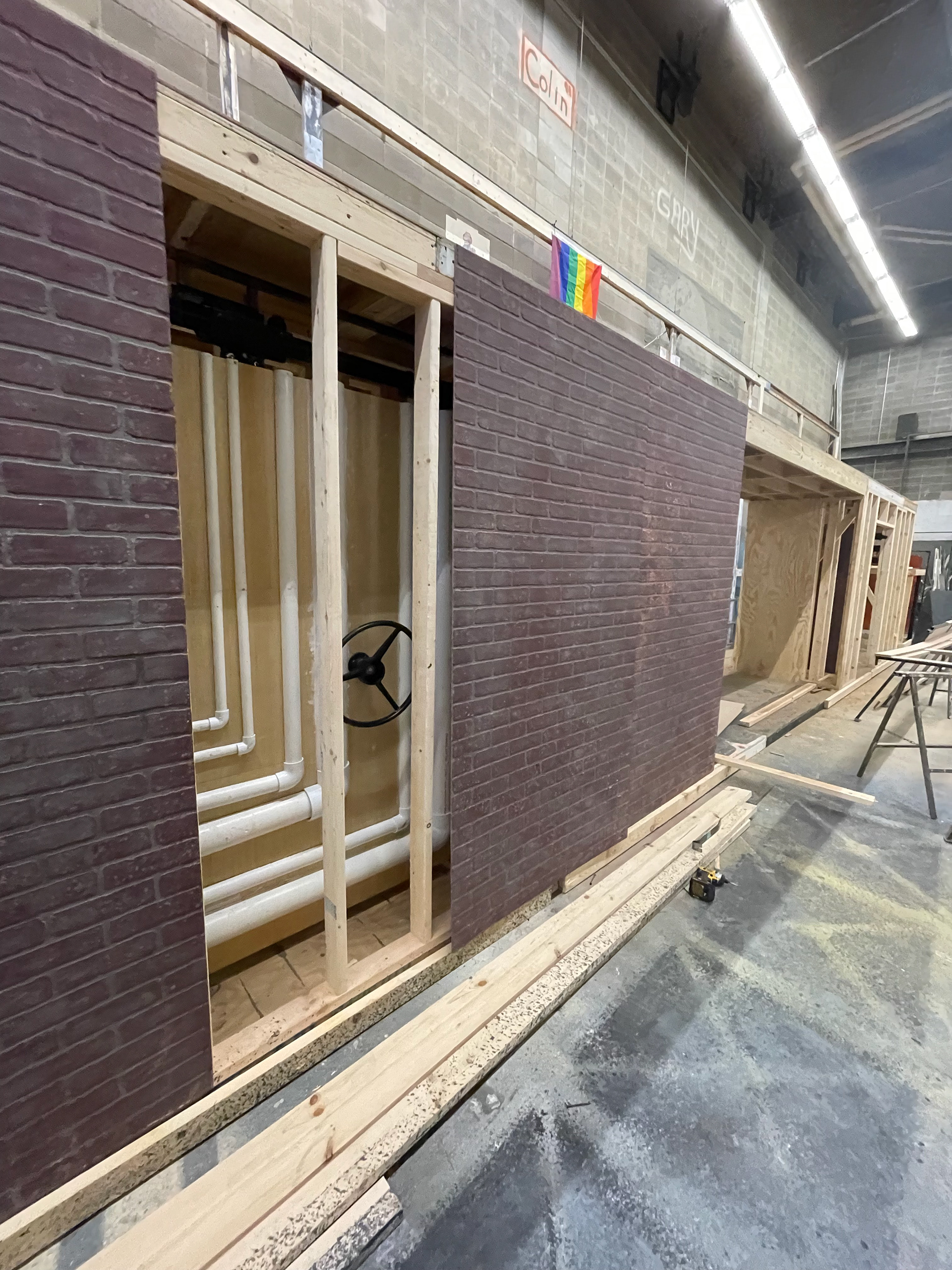 INSTALLING THE SLIDING WALLS AND BRICK FACADE