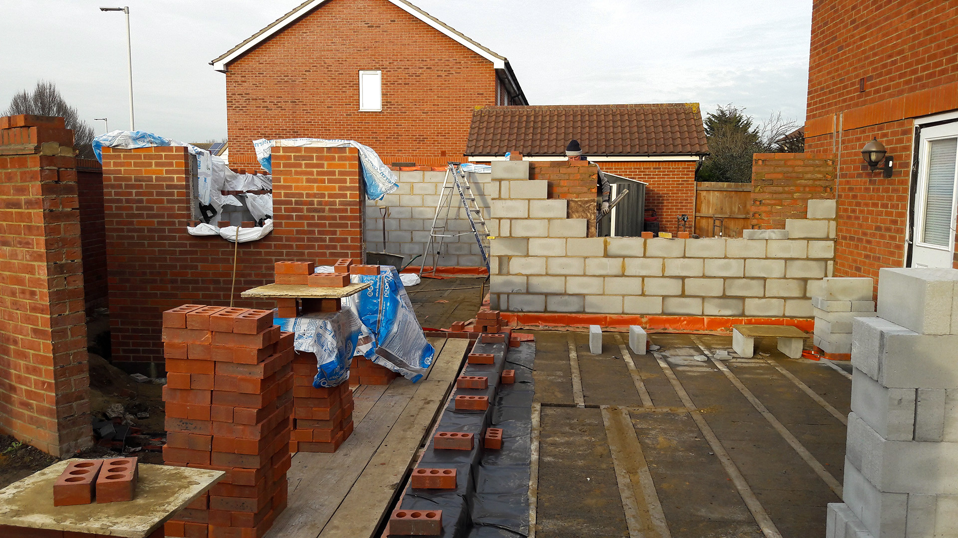 Single and double storey extension brick work underway.
