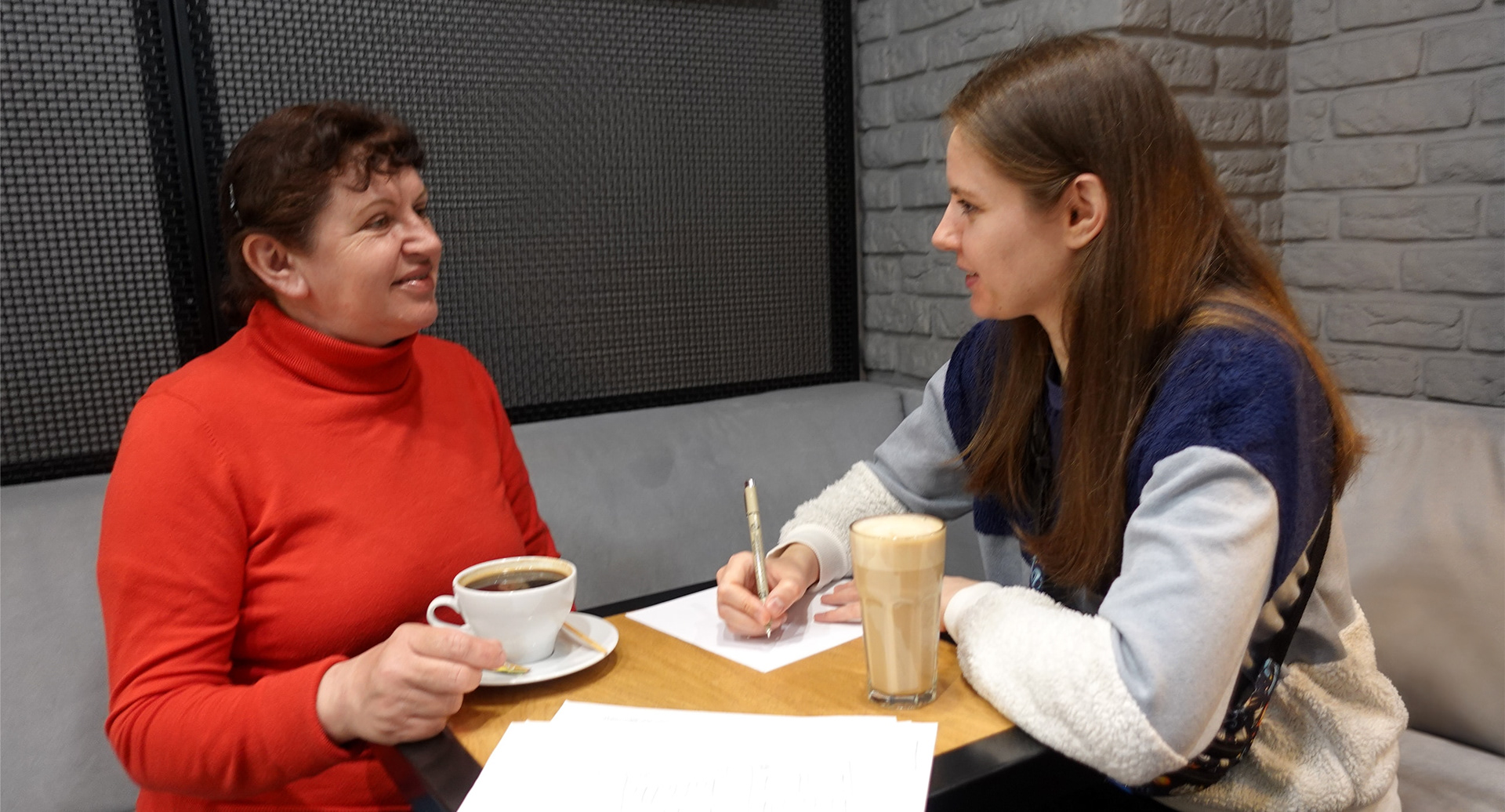 Photo of UI/UX Designer Daria Korol conducting a user interview.