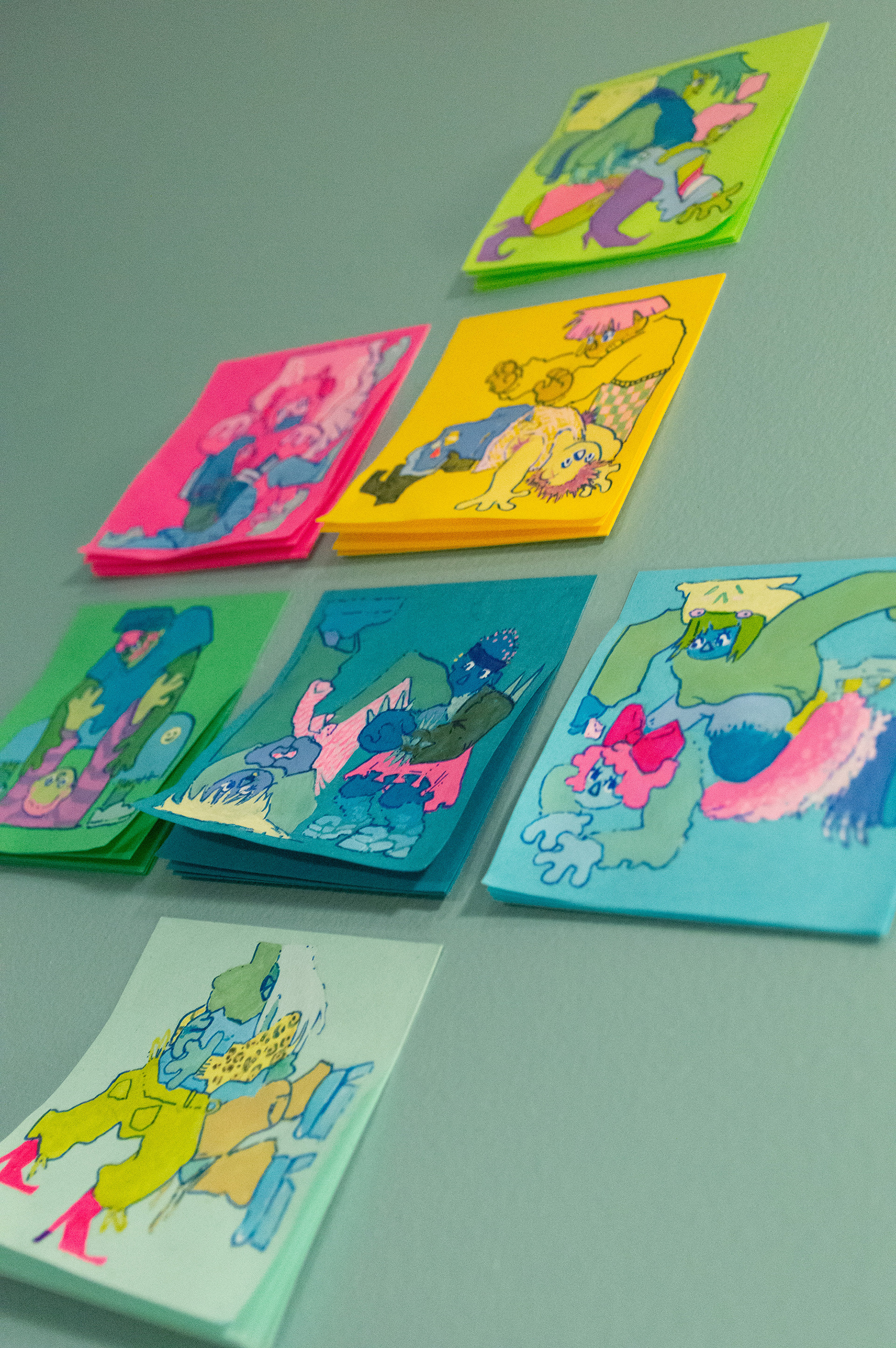 All seven stickies painted for the Sticky 5 show, in lime green; hot pink; banana yellow; green; dark blue; light blue and teal.