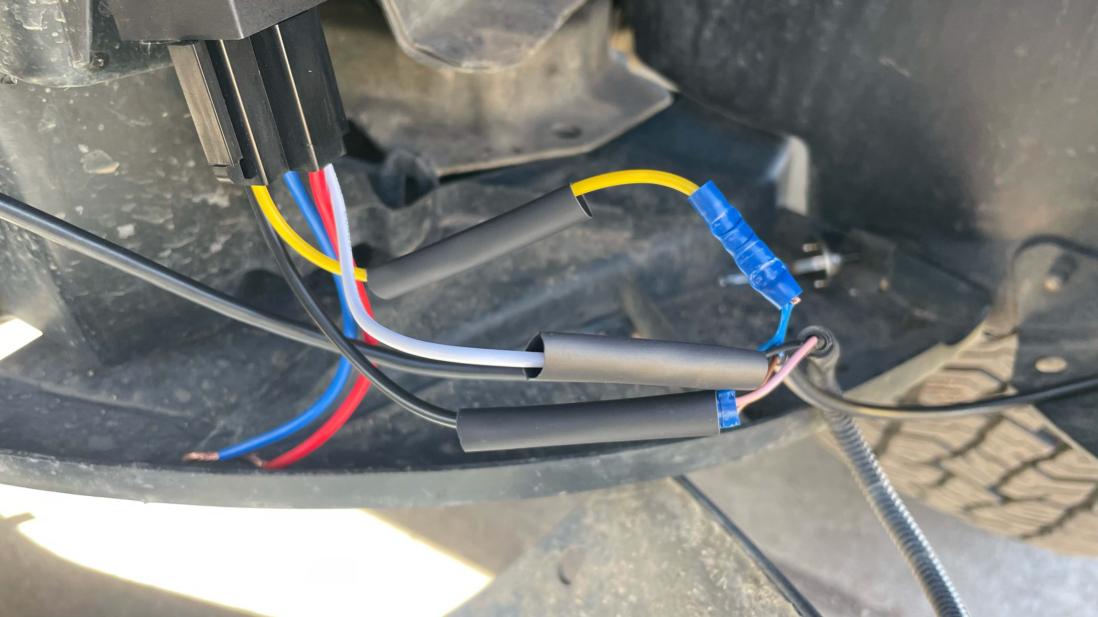 Crimping the wires together prior to heat shrink.