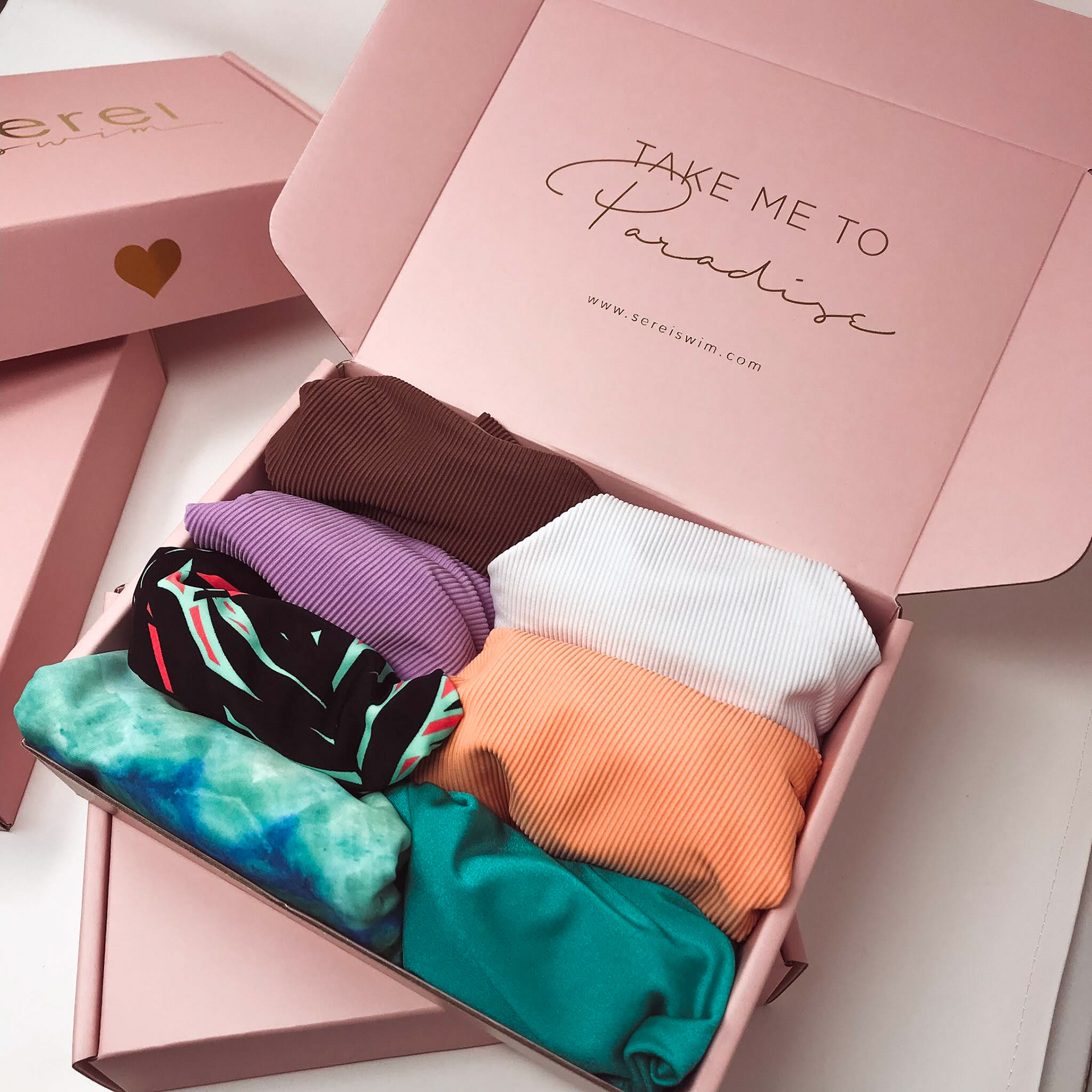 Custom shipping box design for a swimwear brand.