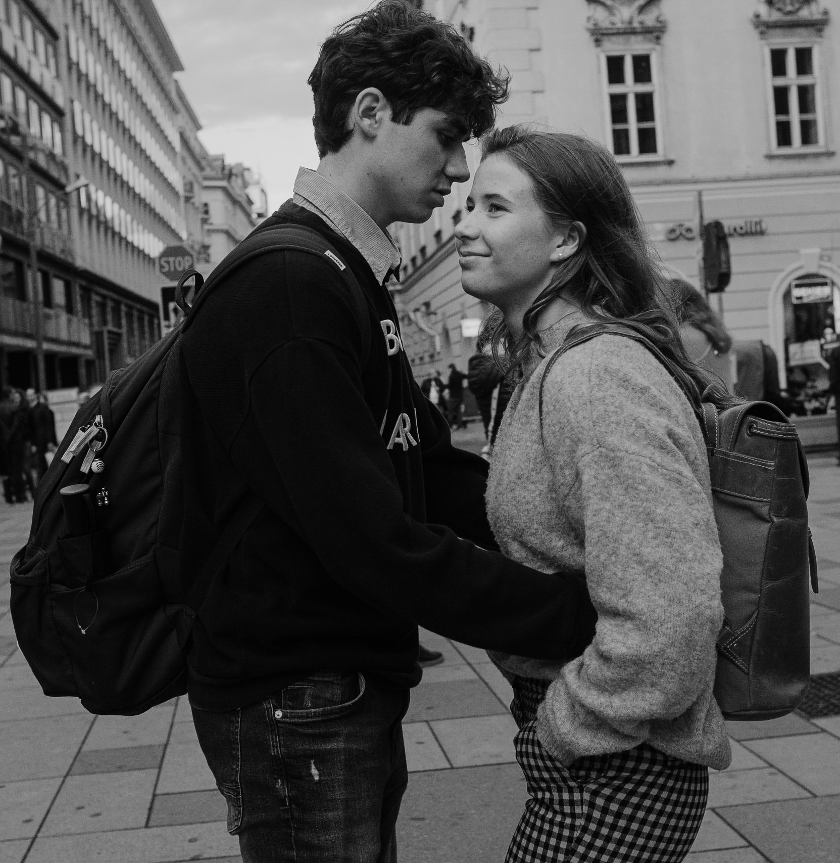 In first look it's a happy couple in love, but Girl and Boy have different emotions, they live in their own worlds, they have no connection in this moment, they see different dreams. Bags behind their backs symbolize their mental and emotional burden.